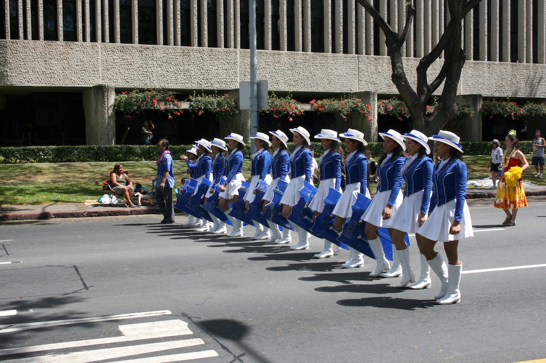 The Warrior Drill Team from Kamehameha Schools in Honolulu marches in the 93rd King Kamehameha Day Floral Parade in Honolulu, Hawaii, on Saturday, June 13, 2009.  The annual parade features floats, mounted units, and military and high school bands and marching units.  The 4.3-mile parade route starts at Iolani Palace in downtown Honolulu and makes its way through Waikiki to Kapiolani Park.