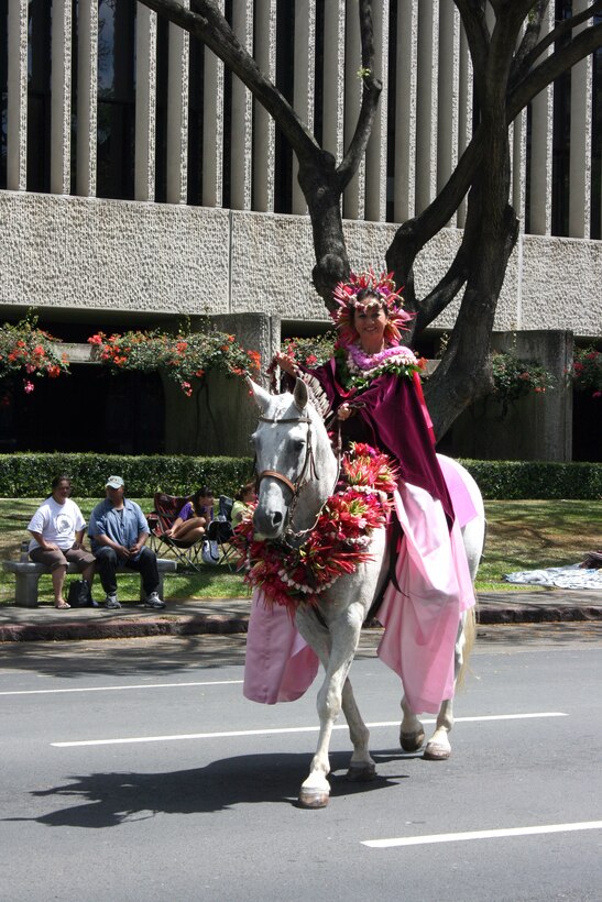 Island of Maui Pa'u Princess Gloria Awakuni rides in the 93rd King Kamehameha Day Floral Parade in Honolulu, Hawaii, on Saturday, June 13, 2009.  The P'au Princesses, representing Maui, Oahu and Kauai, make the lei for themselves and their horses in preparation for this event. The annual parade features floats, mounted units, and military and high school bands and marching units.  The 4.3-mile parade route starts at Iolani Palace in downtown Honolulu and makes its way through Waikiki to Kapiolani Park.