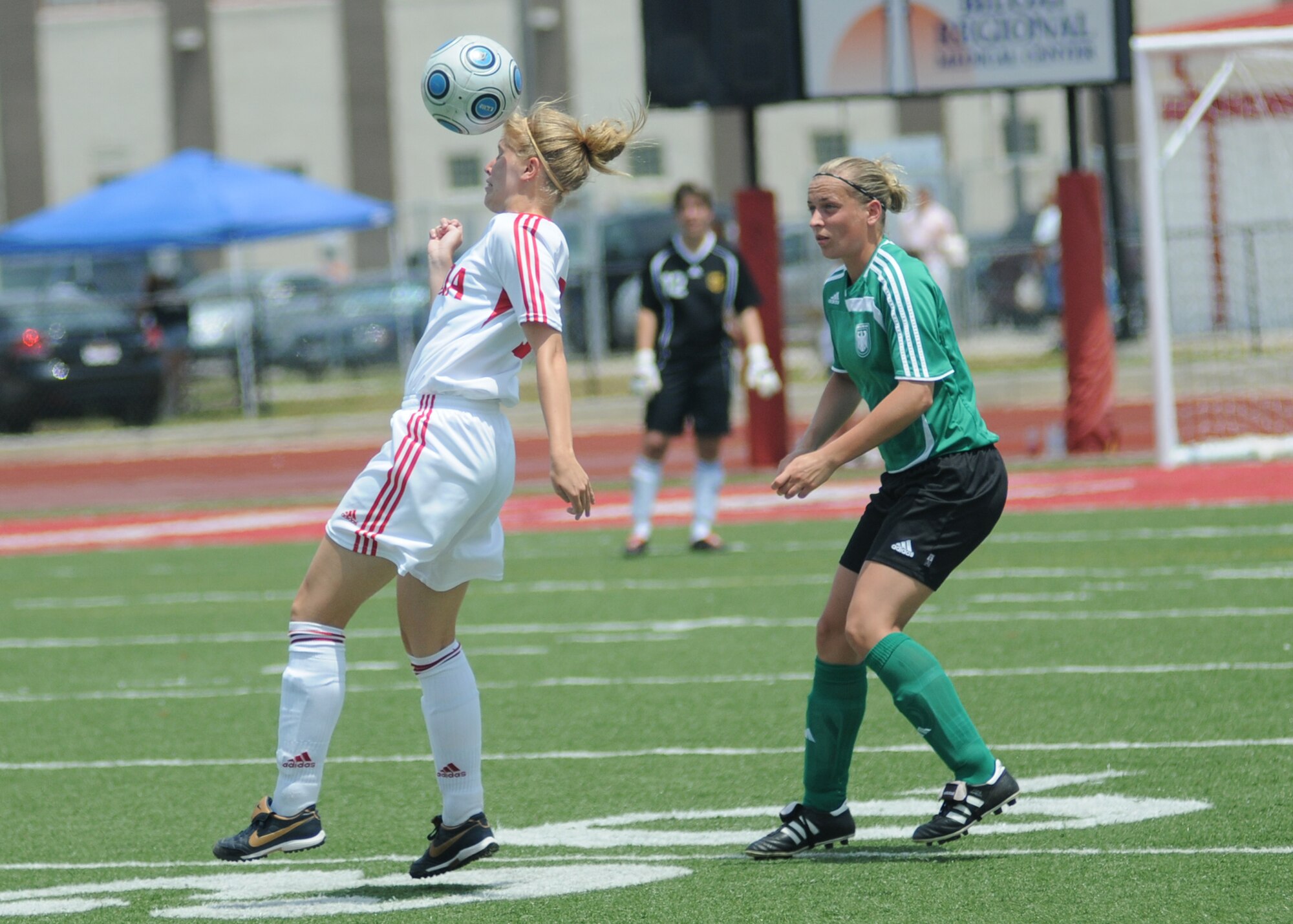 Germany took the consolation match over Canada, 4-1, during the final day of the 5th CISM Women’s Soccer Championship at the Biloxi High Stadium, June 13.  The CISM tournament, hosted by Keesler Air Force Base, also included teams from Brazil, France, The Netherlands, the Republic of South Korea and the United States.   The Brazilian team won the gold medal, Korea earned the silver medal and The Netherlands took the bronze medal.  (U.S. Air Force photo by Kemberly Groue)