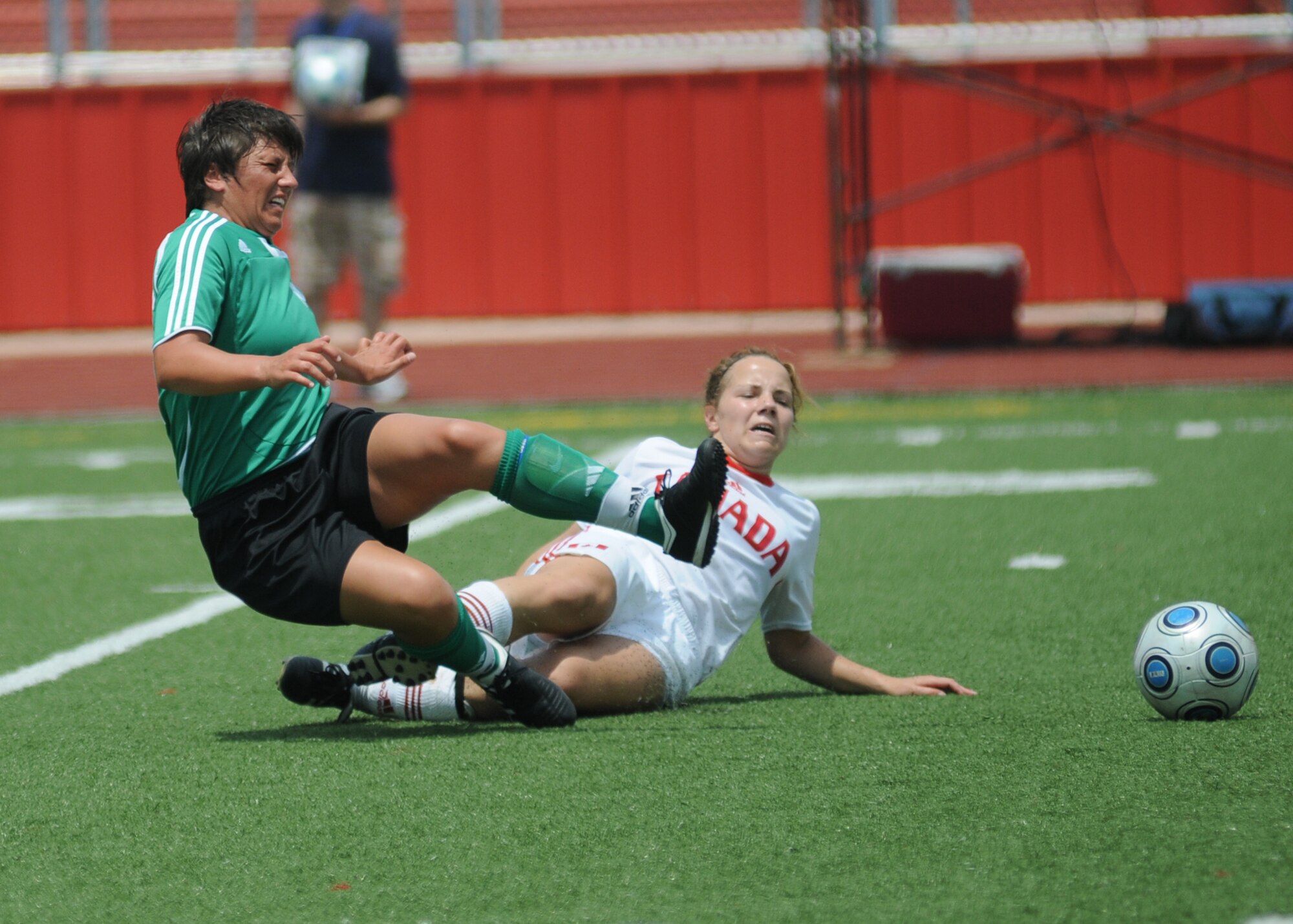 Germany took the consolation match over Canada, 4-1, during the final day of the 5th CISM Women’s Soccer Championship at the Biloxi High Stadium, June 13.  The CISM tournament, hosted by Keesler Air Force Base, also included teams from Brazil, France, The Netherlands, the Republic of South Korea and the United States.   The Brazilian team won the gold medal, Korea earned the silver medal and The Netherlands took the bronze medal.  (U.S. Air Force photo by Kemberly Groue)