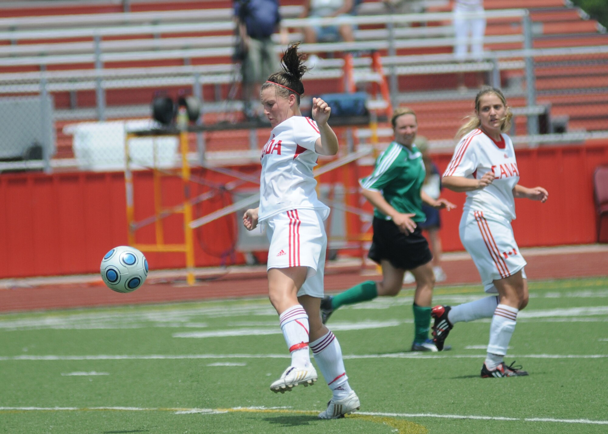 Germany took the consolation match over Canada, 4-1, during the final day of the 5th CISM Women’s Soccer Championship at the Biloxi High Stadium, June 13.  The CISM tournament, hosted by Keesler Air Force Base, also included teams from Brazil, France, The Netherlands, the Republic of South Korea and the United States.   The Brazilian team won the gold medal, Korea earned the silver medal and The Netherlands took the bronze medal.  (U.S. Air Force photo by Kemberly Groue)