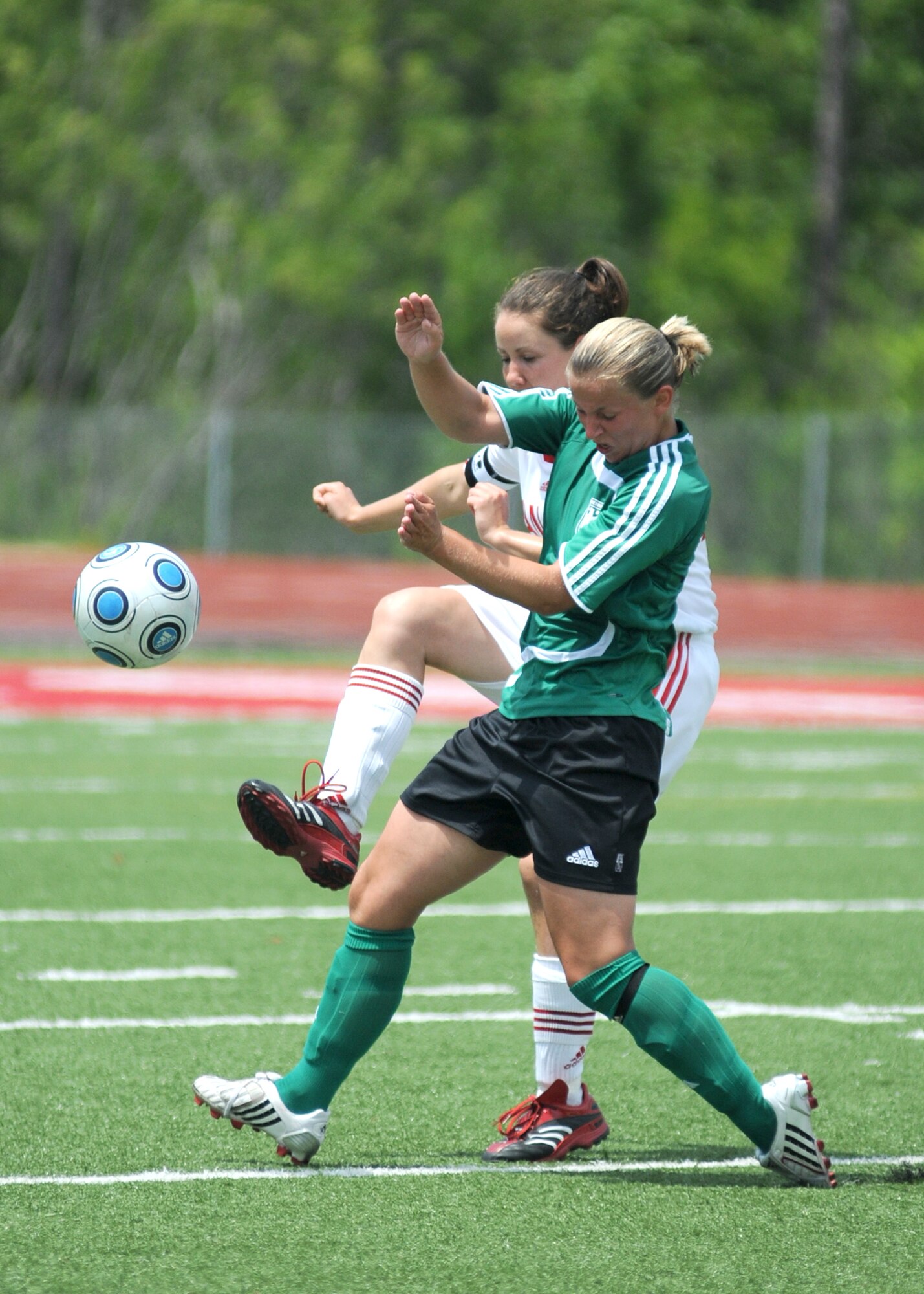 Germany took the consolation match over Canada, 4-1, during the final day of the 5th CISM Women’s Soccer Championship at the Biloxi High Stadium, June 13.  The CISM tournament, hosted by Keesler Air Force Base, also included teams from Brazil, France, The Netherlands, the Republic of South Korea and the United States.   The Brazilian team won the gold medal, Korea earned the silver medal and The Netherlands took the bronze medal.  (U.S. Air Force photo by Kemberly Groue)