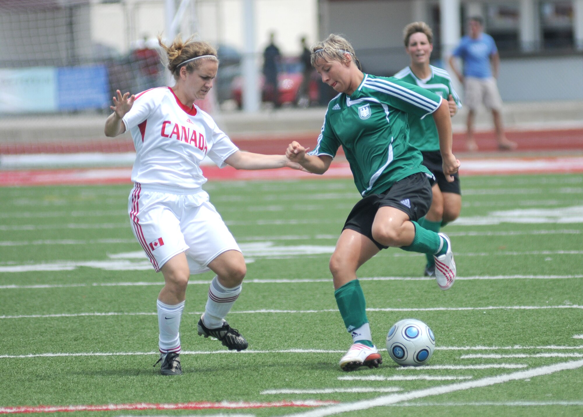 Germany took the consolation match over Canada, 4-1, during the final day of the 5th CISM Women’s Soccer Championship at the Biloxi High Stadium, June 13.  The CISM tournament, hosted by Keesler Air Force Base, also included teams from Brazil, France, The Netherlands, the Republic of South Korea and the United States.   The Brazilian team won the gold medal, Korea earned the silver medal and The Netherlands took the bronze medal.  (U.S. Air Force photo by Kemberly Groue)
