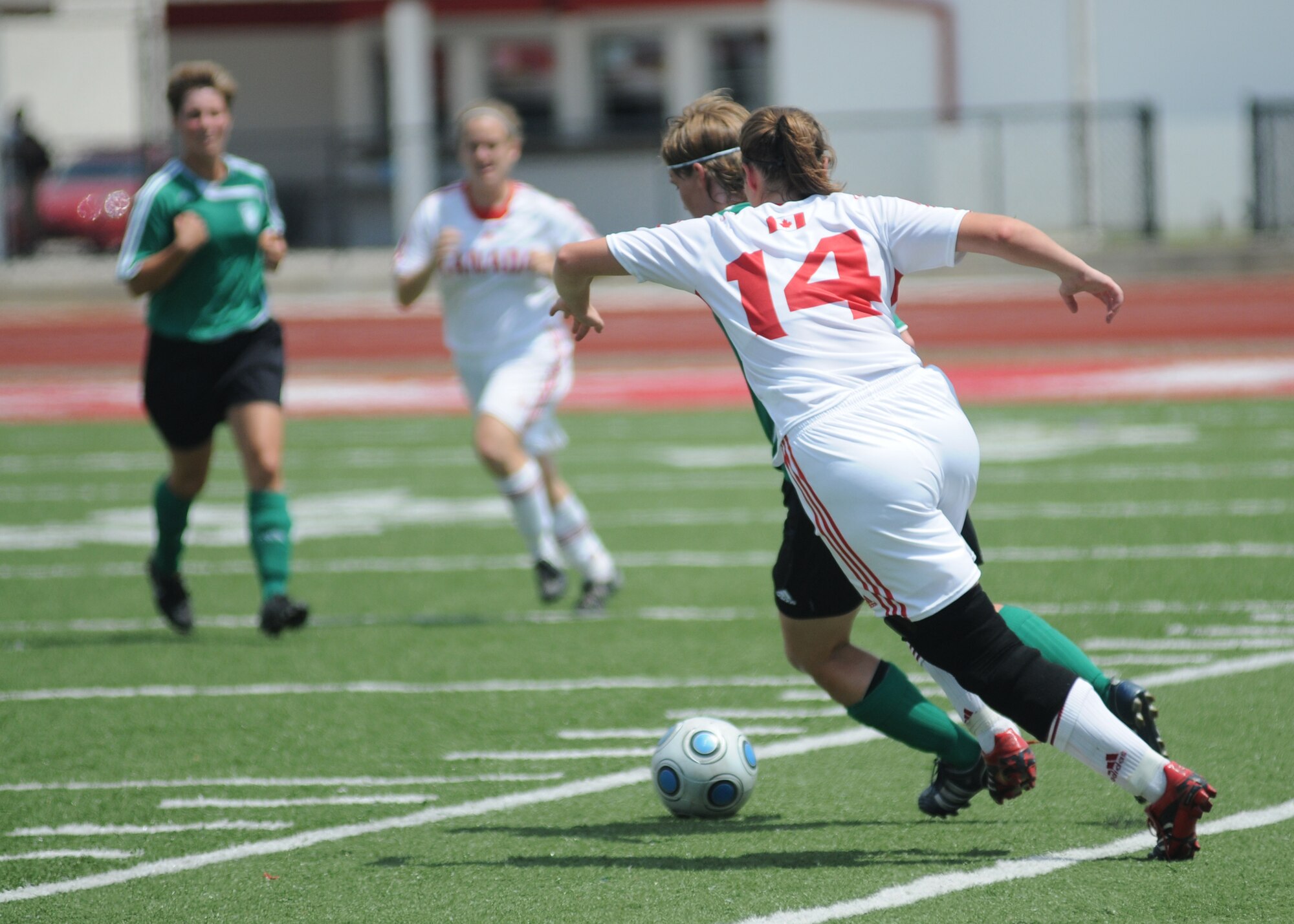 Germany took the consolation match over Canada, 4-1, during the final day of the 5th CISM Women’s Soccer Championship at the Biloxi High Stadium, June 13.  The CISM tournament, hosted by Keesler Air Force Base, also included teams from Brazil, France, The Netherlands, the Republic of South Korea and the United States.   The Brazilian team won the gold medal, Korea earned the silver medal and The Netherlands took the bronze medal.  (U.S. Air Force photo by Kemberly Groue)