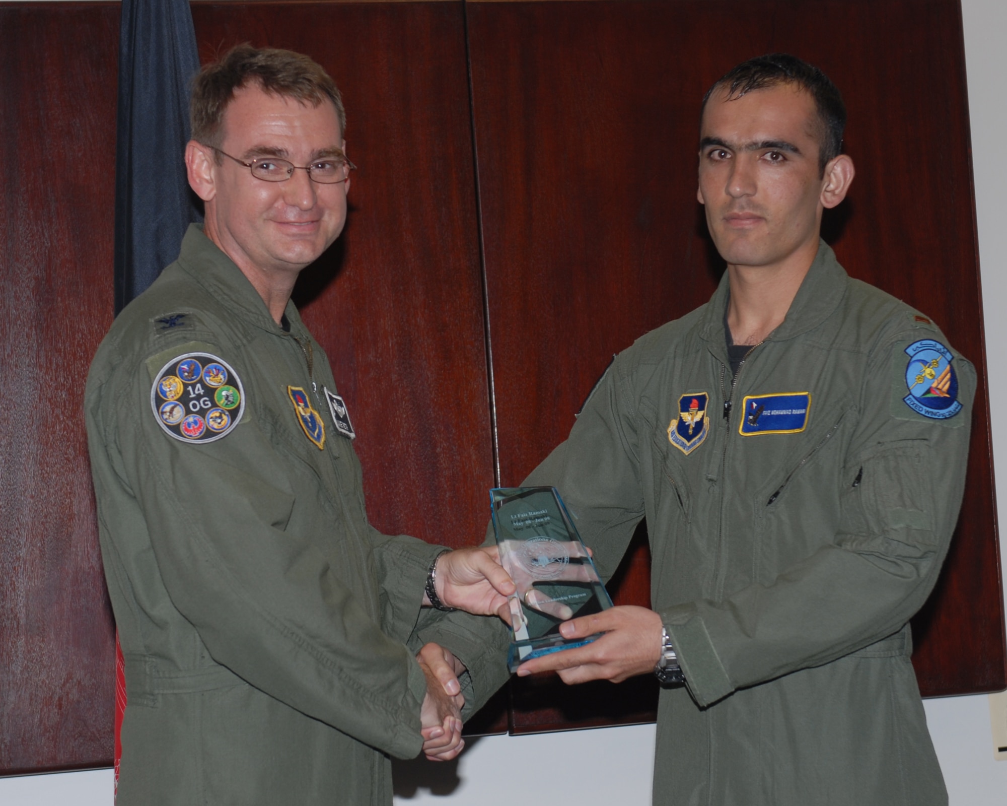 Afghan National Army Air Corps Lt. Faiz Ramaki received this Aviation Leadership award from 14th Operations Group commander Col. David Reth in a special graduation ceremony June 12.  The Aviation Leadership Program is a Secretary of the Air Force initiative to build foreign relations with other air forces. (US Air Force Photo/Melissa Duncan)