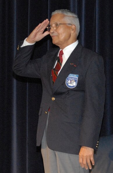 Following his presentation to Air Command and Staff College students, retired Col. Charles McGhee salutes the officers at ACSC’s Wood Auditorium on June 5. Colonel McGhee, a former Tuskegee Airman who joined the Army in 1942, is a veteran of World War II, the Korean War and the Vietnam War. He flew 409 combat missions during his Air Force career. (U.S. Air Force photo/Roger Curry)