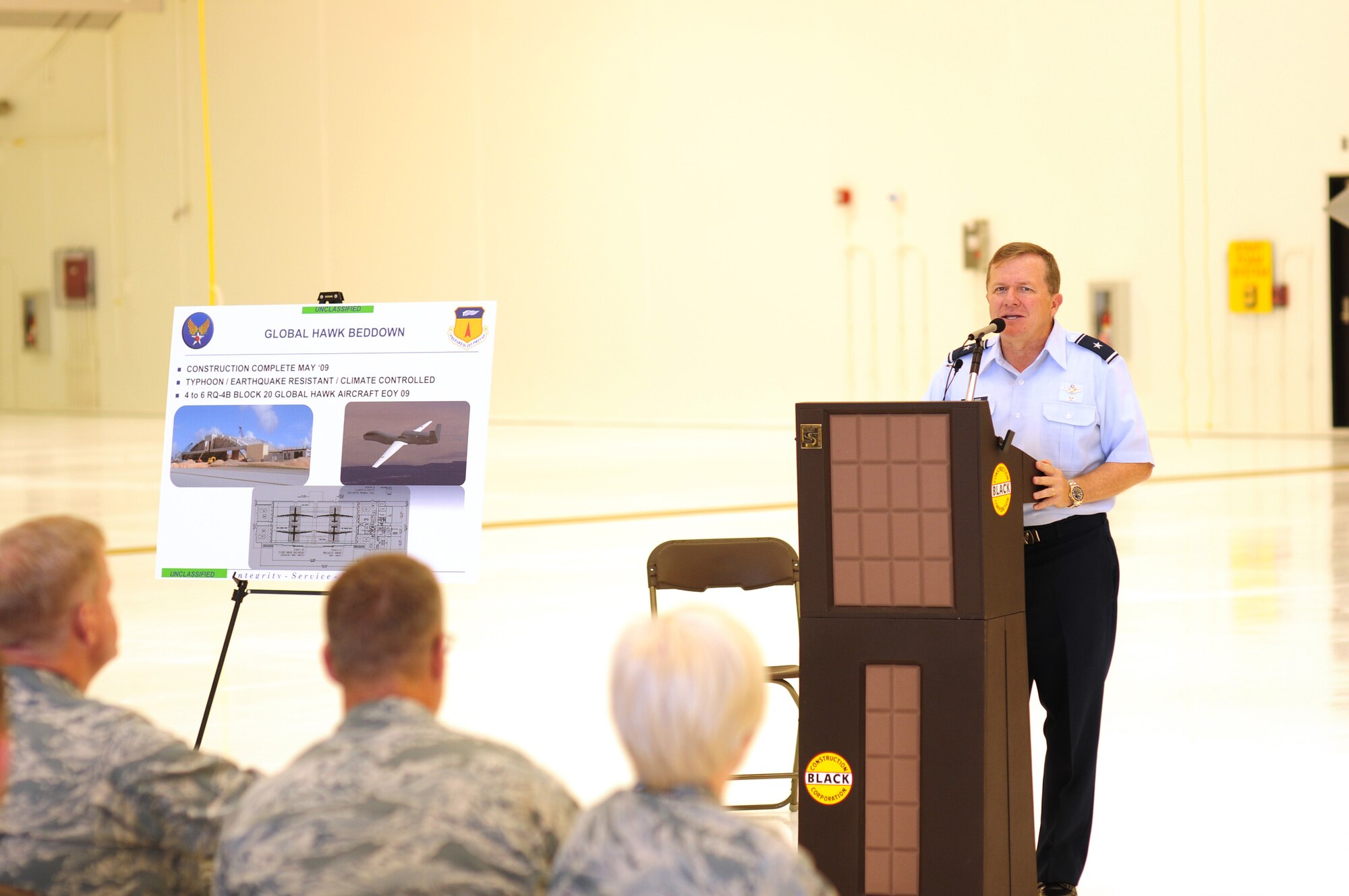 ANDERSEN AIR FORCE BASE, Guam - Brig. Gen. Phil Ruhlman, 36th Wing commander, praises the efforts of the Airmen, Sailors, civilians and contractors June 12 for their role in constructing Hangar 6 a reality.  Black Construction lead the 20-month construction project in which employees spent more than 486,000 man-hours without time lost due to an accident. Hangar 6 is the future home of the Global Hawk unmanned aerial vehicle.   (US Air Force photo by Tech. Sgt. Michael Boquette)
