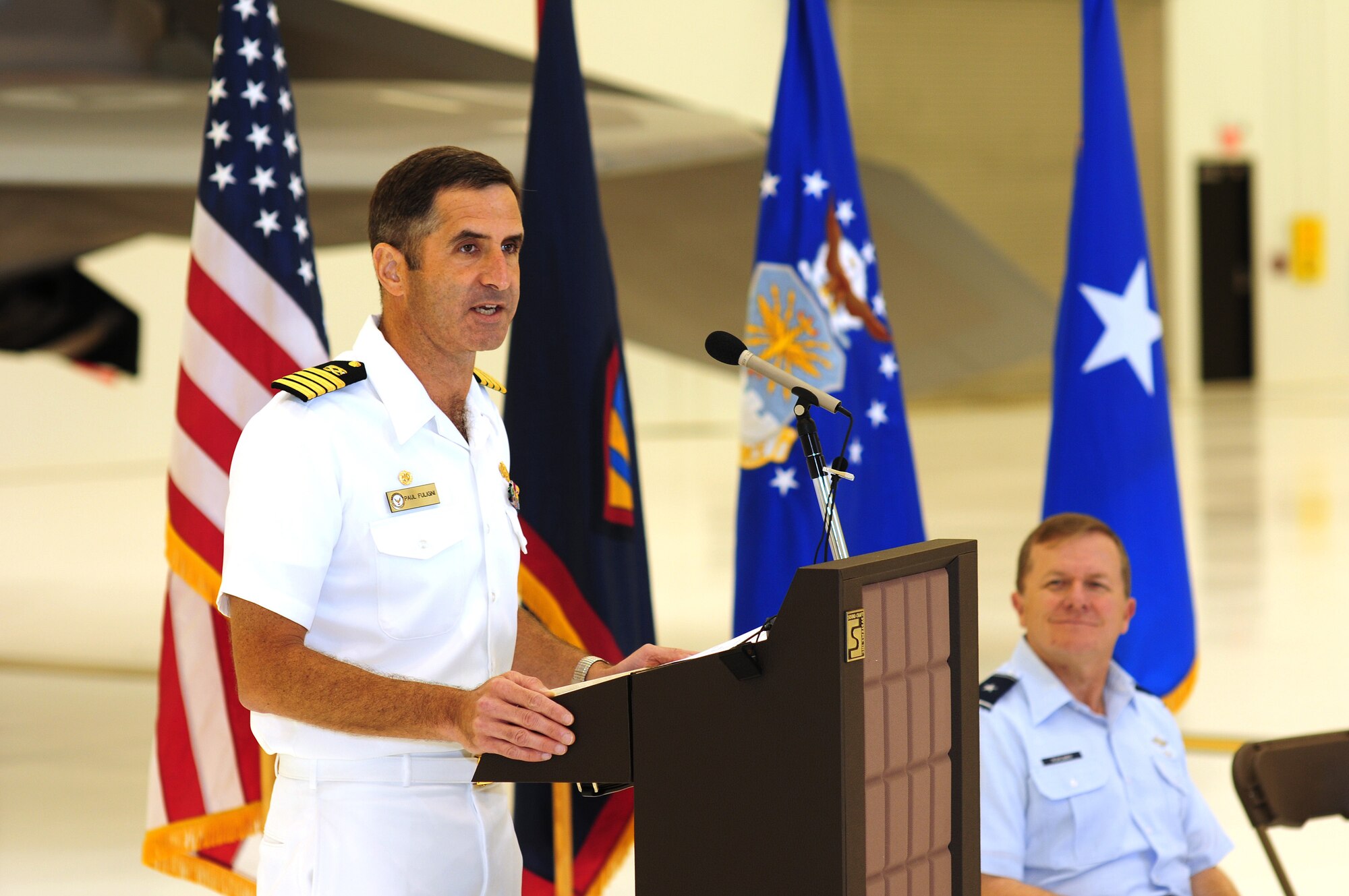 ANDERSEN AIR FORCE BASE, Guam  - Capt. Paul Fuligni, commander of Naval Facilities Engineering Command Marianas, talks about the significant achievement in engineering and construction the Global Hawk facility during a ribbon cutting ceremony June 12.  Hangar 6 is a typhoon proof, earthquake resistant air conditioned hangar built to accommodate some of the newest and most sophisticated aircraft flying the skies today. Hangar 6 is the future home of the Global Hawk unmanned aerial vehicle.   (US Air Force photo by Tech. Sgt. Michael Boquette)
