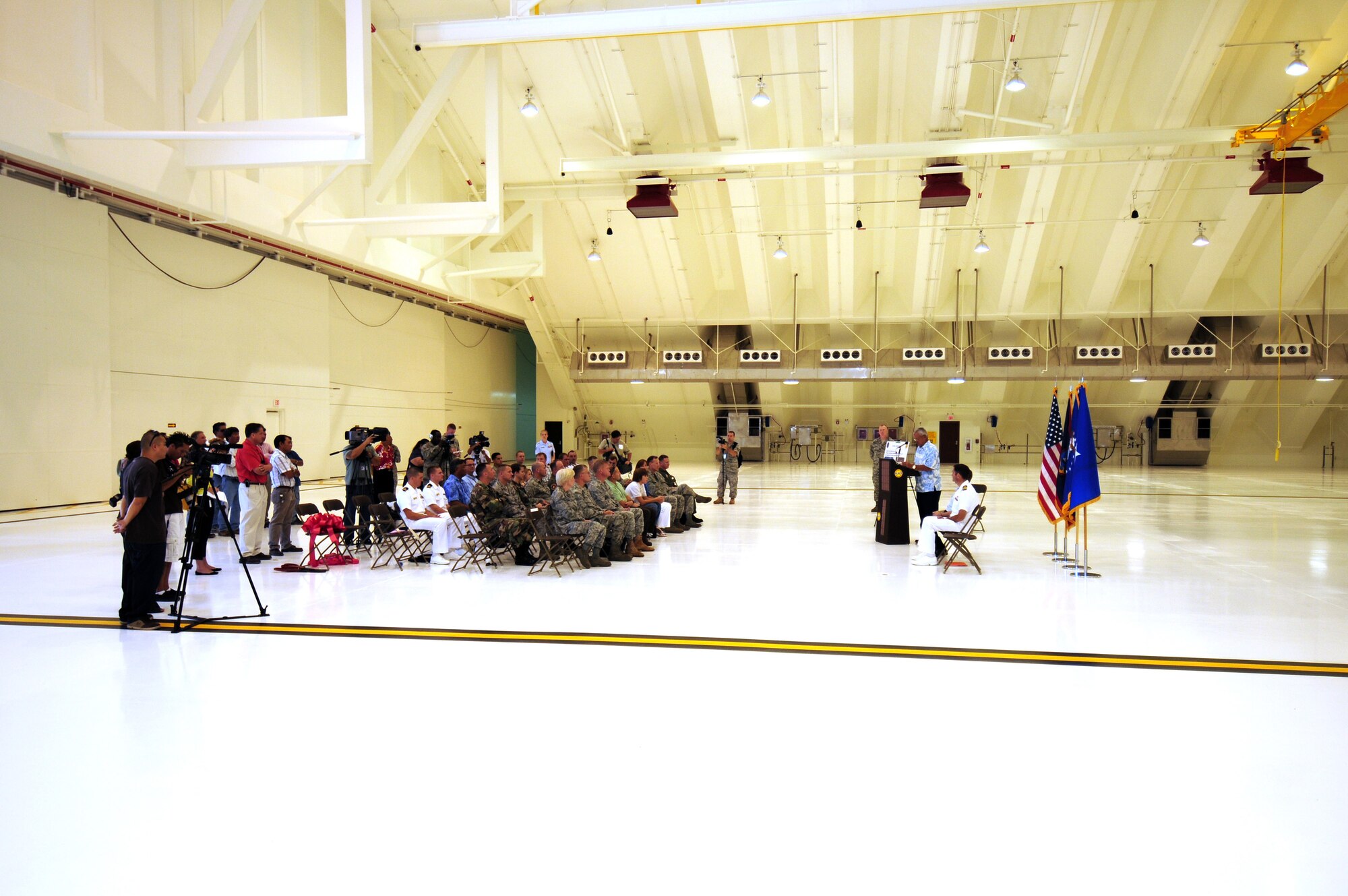 ANDERSEN AIR FORCE BASE, Guam - Leonard Kaae, Black Construction senior vice president and general manager, the efforts it took contractors to build the Global Hawk facility during a ribbon cutting ceremony June 12. Hangar 6 is the future home of the Global Hawk unmanned aerial vehicle.   (U.S. Air Force photo by Tech. Sgt. Michael Boquette)
