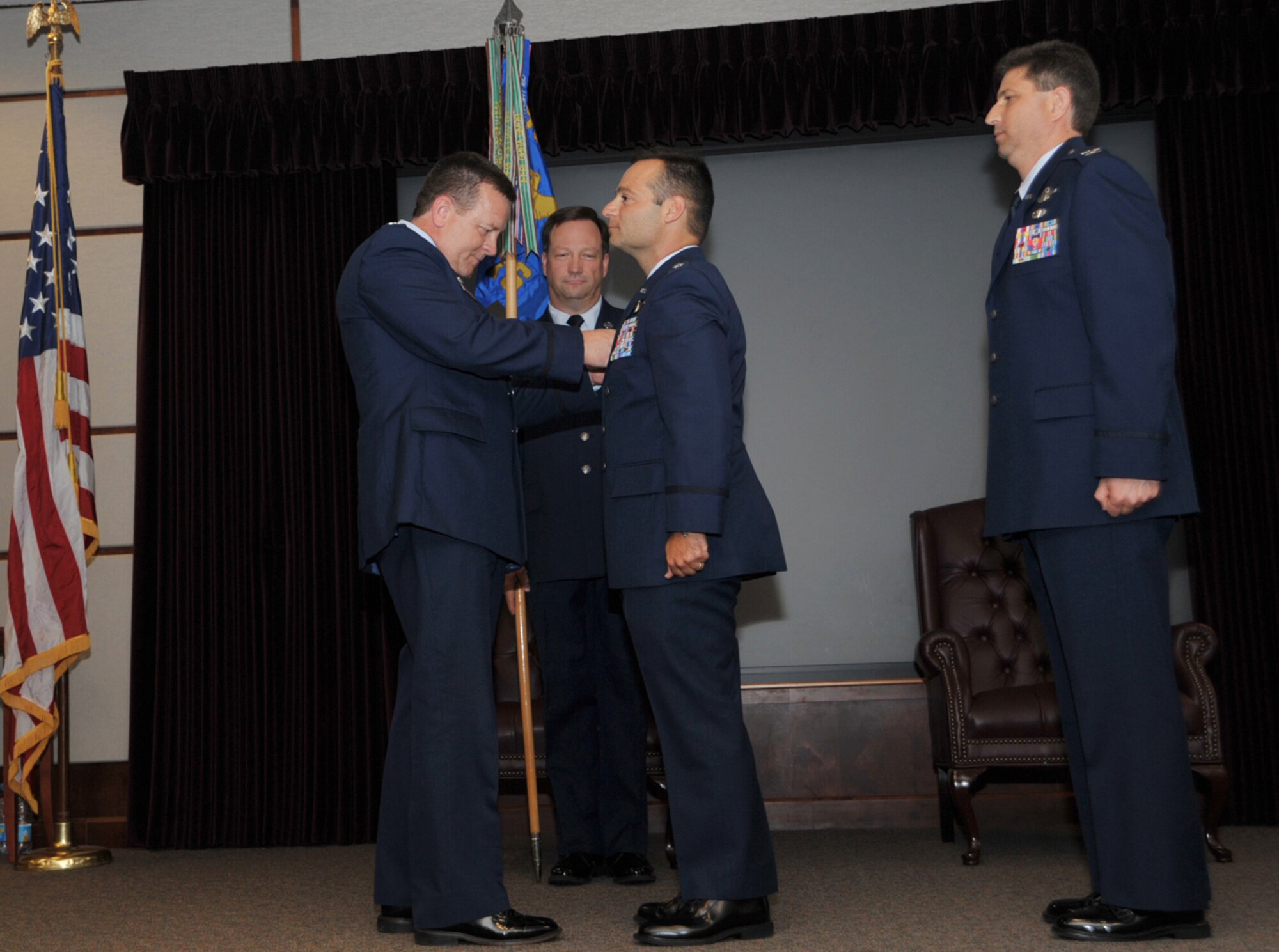 Col. Edsel A. "Archie" Frye Jr. clasps a commander's pin to Lt. Col. Tony Brusca's jacket during a 18th Air Refueling Squadron change of command ceremony on June 13. Colonel Brusca, a KC-135 Stratotanker pilot, took command of the 18th ARS after serving under every one of the squadron's previous commanders. The 18th ARS is the flying unit of the 931st Air Refueling Group, an Air Force Reserve unit at McConnell Air Force Base, Kan. Colonel Frye is the commander of the 931st ARG. (U.S. Air Force photo/Tech. Sgt. Jason Schaap) 