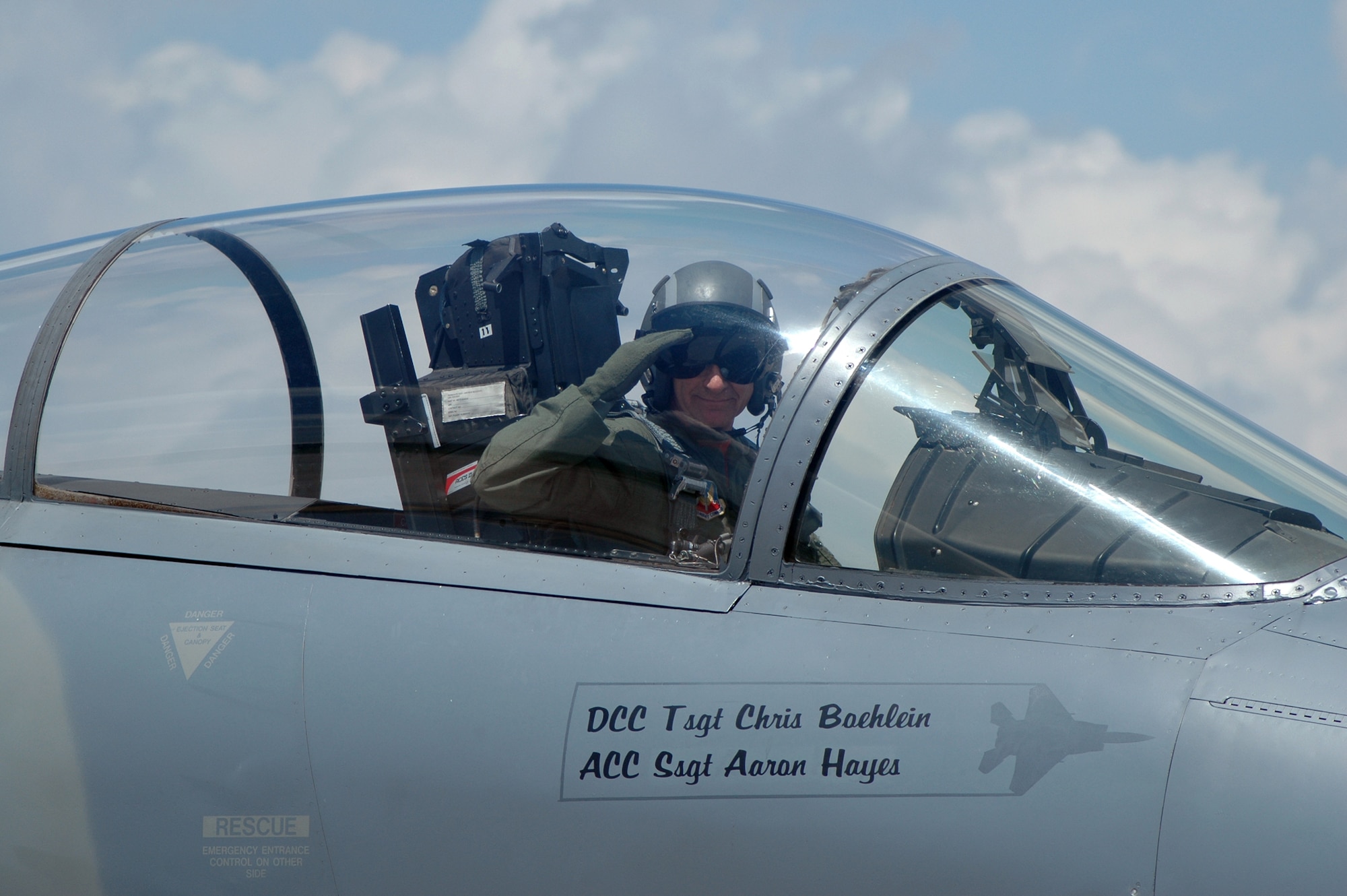 Lt. Col Reed "Snake" Drake salutes during his final take off during the end of era ceremony for the 131st Fighter Wing June, 13 2009. Lt. Col Drake is the squadron commander for the 110th Fighter Squadron at Lambert ANG base. (Photo by SrA Amber Hodges)