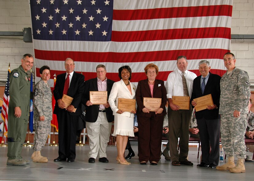 Members of the 131st Fighter Wing present local mayors, alderman and the St Louis airport director with tokens of appreciation for their community support of the 131st FW, during the end of era ceremony June 13, 2009. (Photo by SrA Amber Hodges)