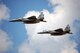 Col. Robert 'MOS' Mohr, 131st Operations Group commander, and Lt. Col. Reed 'Snake' Drake, 110th Fighter Squadron commander, do a final fly-by for the crowd at the End of Era event held at the 131st Fighter Wing Lambert International Airport June 13. This was the last flight for the F-15C's with the 131st FW before heading to Hickam AFB, Hawaii. (Photo by Senior Airman Jessica Donnelly)
