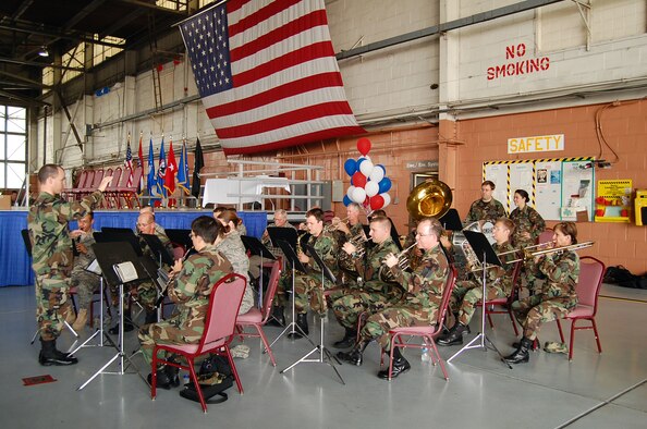 The 571st Band of the Central States plays at the End of Era event at the 131st Fighter Wing Lambert International Airport June 13. The event was held in honor of saying 'goodbye' to the last of the F-15's with the 131st FW before being relocated to Hickam AFB, Hawaii. (Photo by Senior Airman Jessica Donnelly)