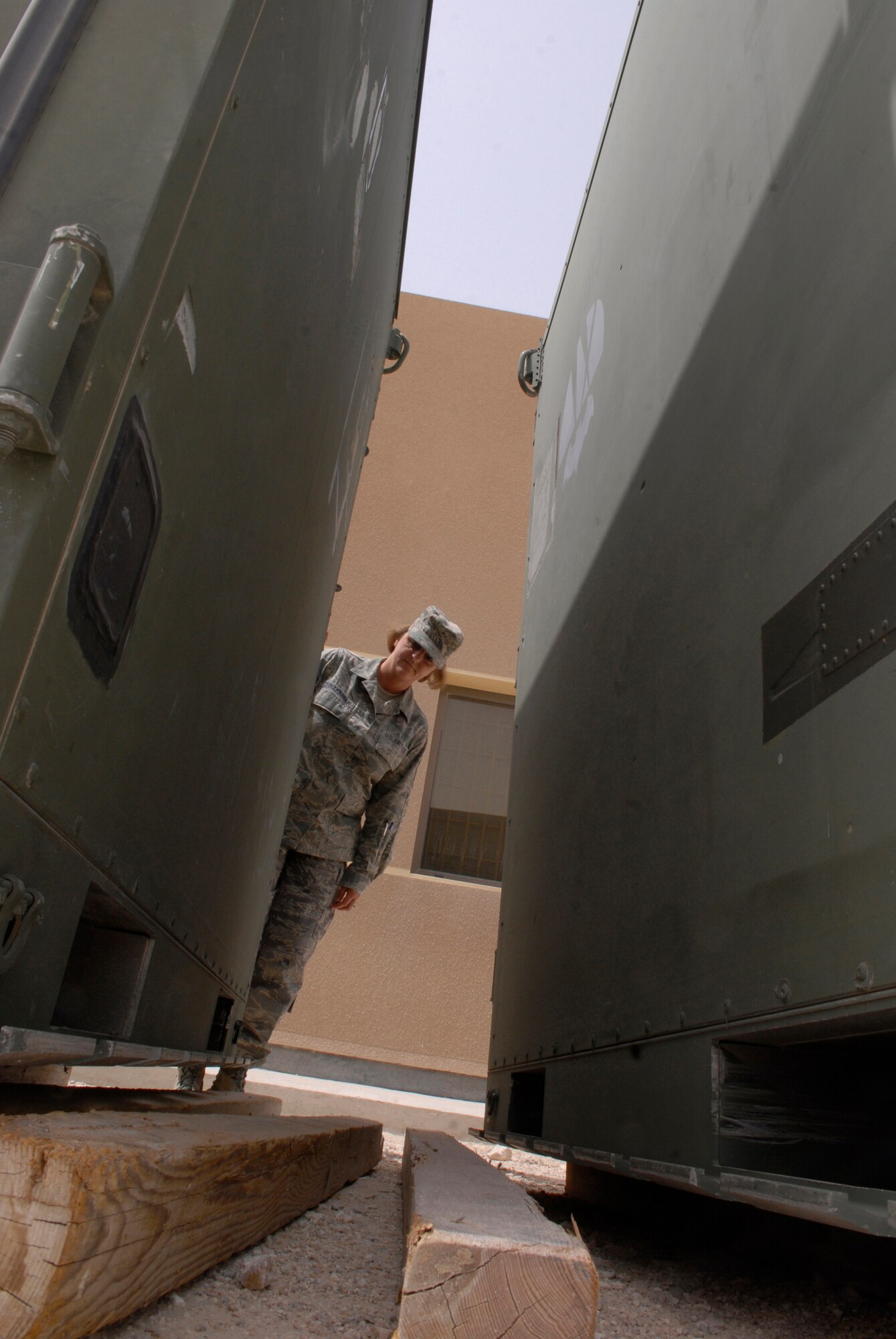 Master Sgt. Diana Shinabarger, 379th Expeditionary Operations Group command section superintendent, performs a scheduled Random Antiterrorism Measure (RAM) inspection for her facility, June 9, 2009, at an undisclosed location in Southwest Asia.  RAMs are conducted to help ensure the safety and security of personnel and assets.  Sergeant Shinabarger hails from Buffalo, N.Y. and is deployed from Langley Air Force Base, Va., in support of Operations Iraqi and Enduring Freedom and Combined Joint Task Force - Horn of Africa.  (U.S. Air Force photo/Senior Airman Andrew Satran/released)