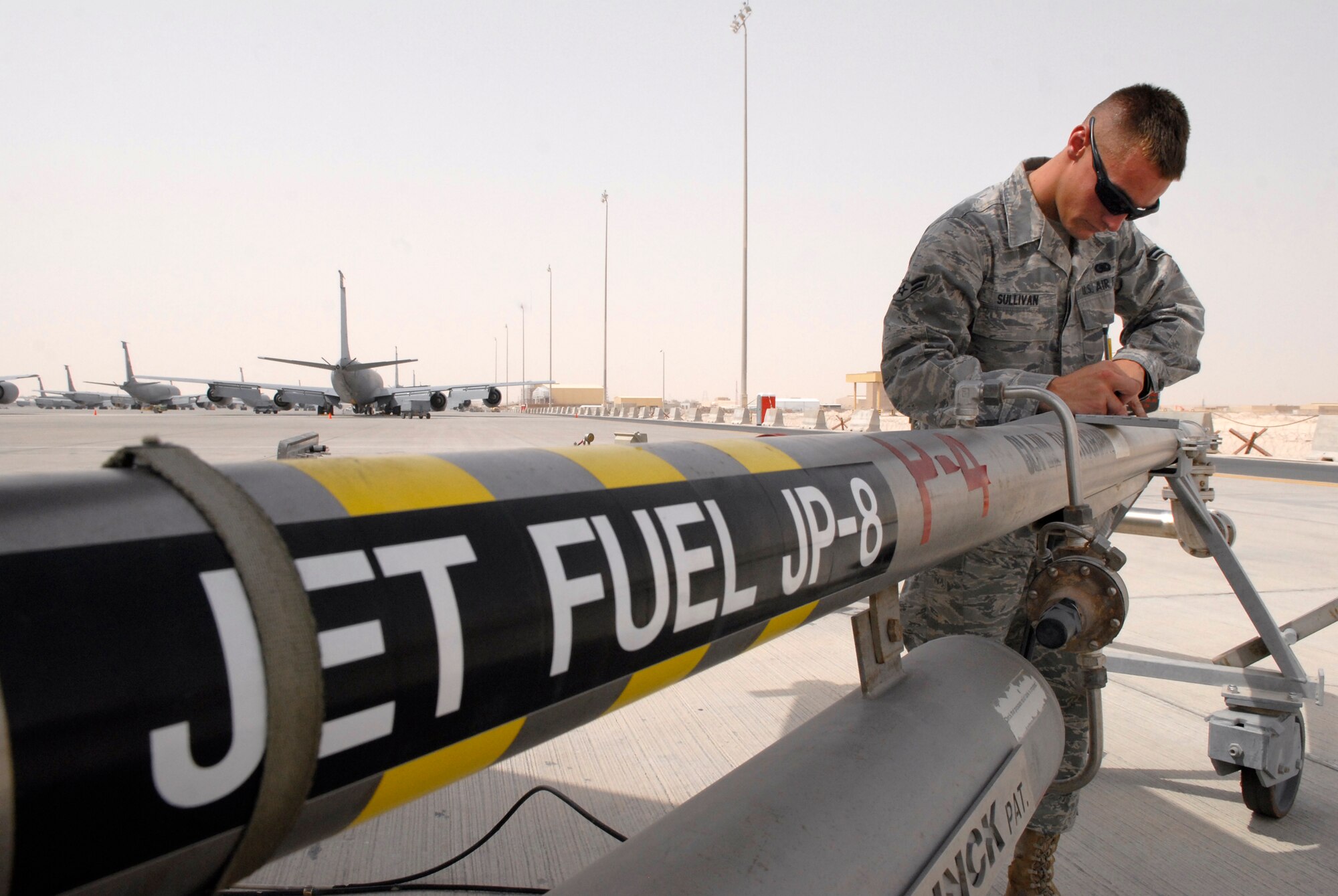 Airman 1st Class Brandon Sullivan, a 379th Expeditionary Logistics Readiness Squadron fuels distribution operator, writes out a receipt for an issued amount of fuel after refueling a KC-135R Stratotanker, June 10, 2009, at an undisclosed location in Southwest Asia.  Airman Sullivan pumped 16,083 gallons of JP-8 fuel at 457 gallons per minute through the system to refuel the aircraft.  Fuel distribution operators deliver fuel to aircraft around the clock everyday of the year to meet the ongoing demands of the mission.  Airman Sullivan hails from Burlington, Iowa and is deployed from Kadena Air Base, Japan, in support of Operations Iraqi and Enduring Freedom and Combined Joint Task Force - Horn of Africa.  (U.S. Air Force photo/Senior Airman Andrew Satran/released)  