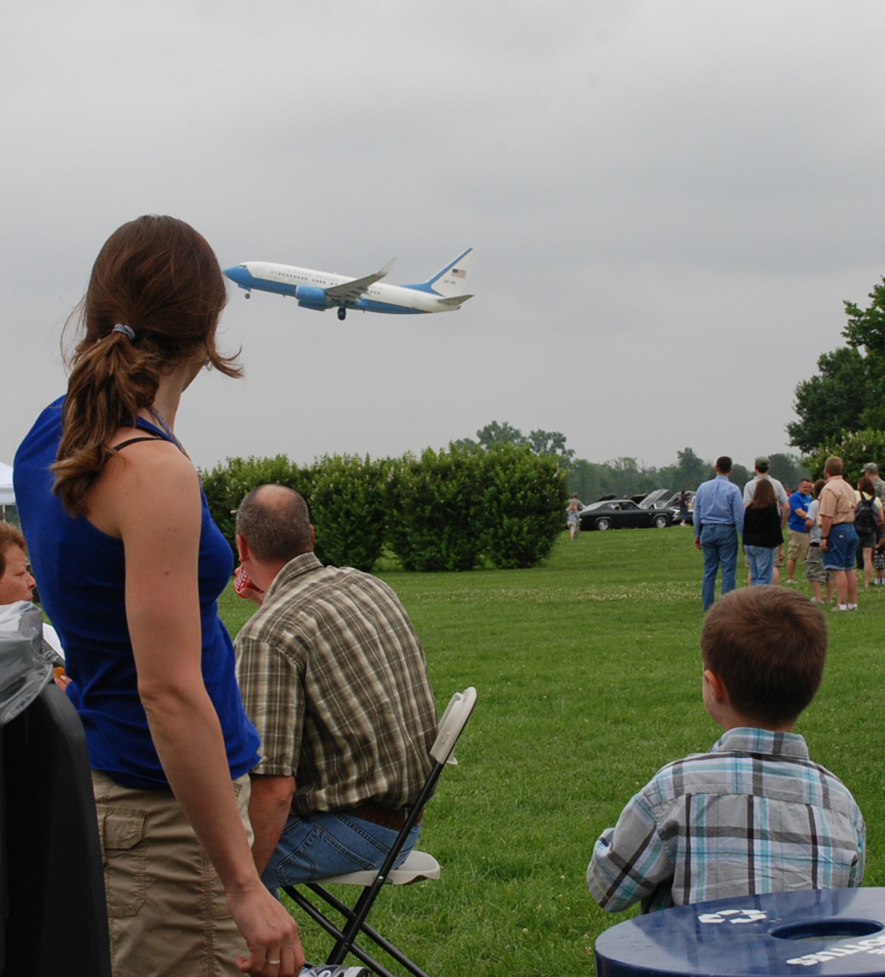 The Air Force Reserve Command's only Illinois flying wing takes off on another C-40C mission as families watch on the ground below during a picnic.  (U.S. Air Force photo/Maj. Stan Paregien)