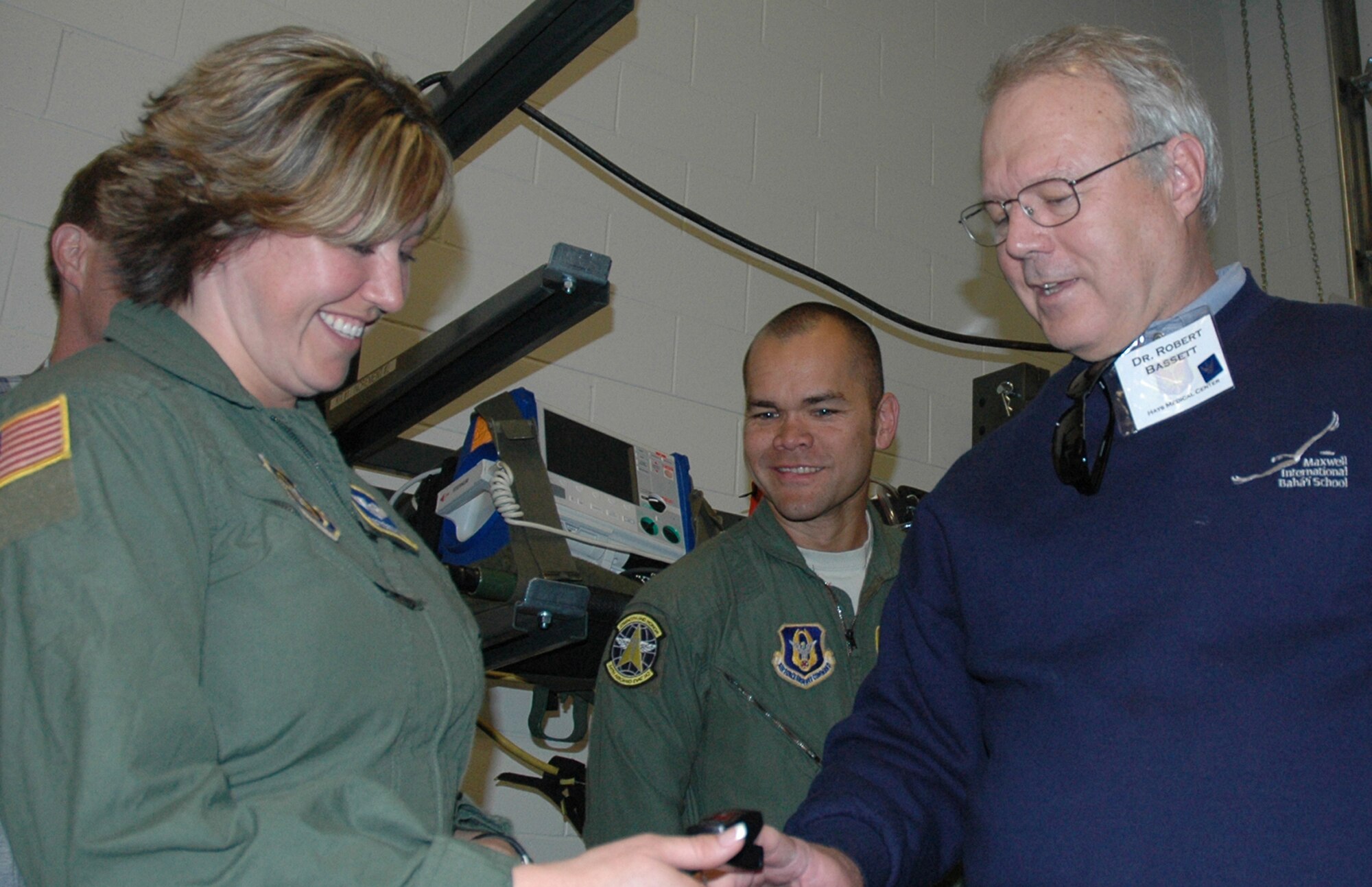 Dr. Robert Bassett (right) gets his vitals checked June 13 by Tech Sgt. Rebecca Diaz, an aeromedical technician with the 34th Aeromedical Evacuation Squadron at Peterson Air Force Base, Colo. Dr. Bassett, a physician with Hays Medical Center in Kansas, was one of 17 employers invited to attend the 302nd Airlift Wing's annual Employer Appreciation Day. The employers, who employ an Air Force reservist, were treated to an up close look of the wing, an orientation flight in a C-130 Hercules and a traditional meal at the base's dining facility. (U.S. Air Force photo/Tech. Sgt. Daniel Butterfield)