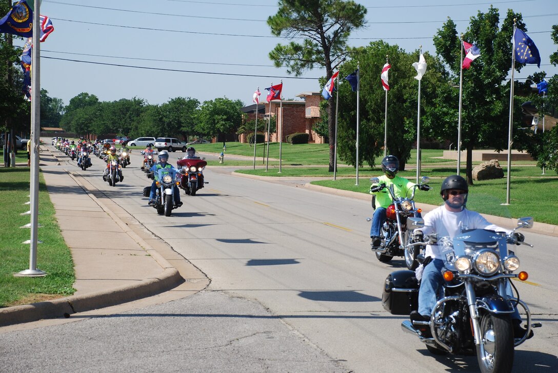 The Green Knights Motorcycle club rides through Sheppard June 15, promoting the International Motorcycle Ride to Work Day to increase motorcycle awareness and safety. There were 24 riders that assembled for the ride which was escorted by the 82nd Security Forces Squadron through the base. (U.S. Air Force photo/ Airman 1st Class Matthew Varga)
