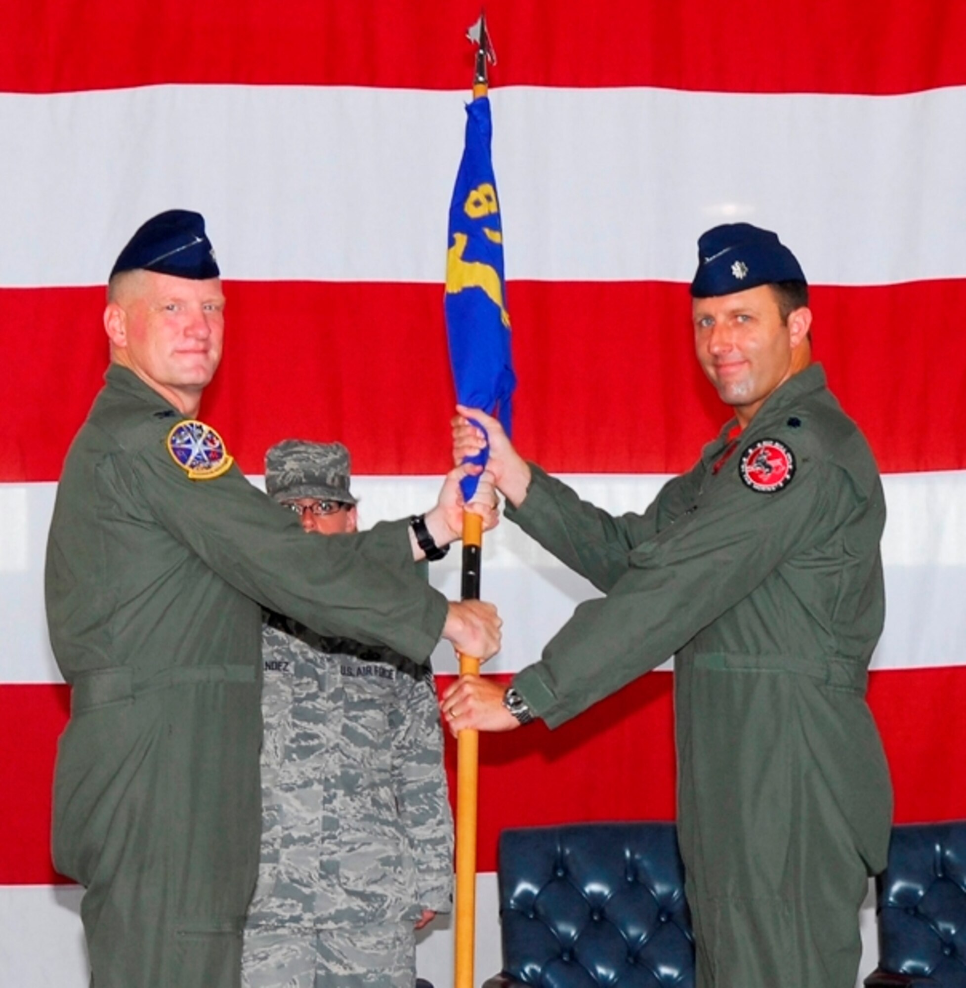 LAUGHLIN AIR FORCE BASE, Texas--Lt. Col. Robert Brust receives the 87th Flying Training Squadron guidon from Col. Martin Schans, 47th Operations Group commander, during a change of command ceremony here June 12. Colonel Brust is a senior pilot with more than 1500 hours of pilot time, primarily in the F-15C. (U.S. Air Force photo by Memo Lopez)