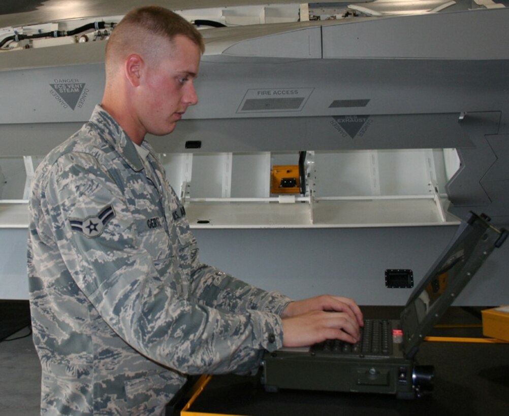 Airman 1st Class Philip Gertz, 362nd Training Squadron, looks up a technical order on a laptop in the F-22 Aircraft Maintenance course. He  earned an ACE award June 12 for maintaining a 100 percent average throughout the course. (U.S. Air Force photo/ Technical Sergeant Jason Troxell)