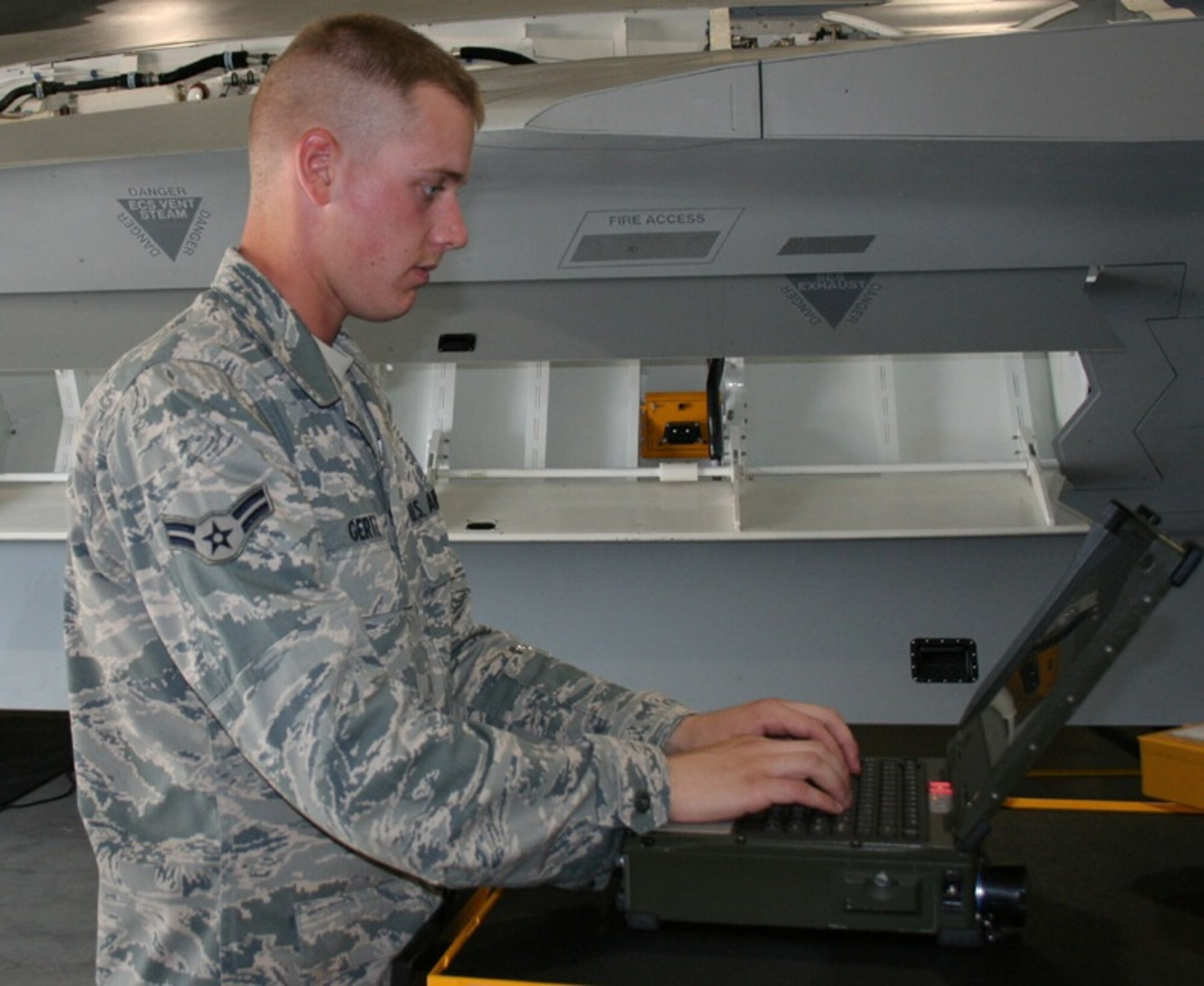 Airman 1st Class Philip Gertz, 362nd Training Squadron, looks up a technical order on a laptop in the F-22 Aircraft Maintenance course. He  earned an ACE award June 12 for maintaining a 100 percent average throughout the course. (U.S. Air Force photo/ Technical Sergeant Jason Troxell)