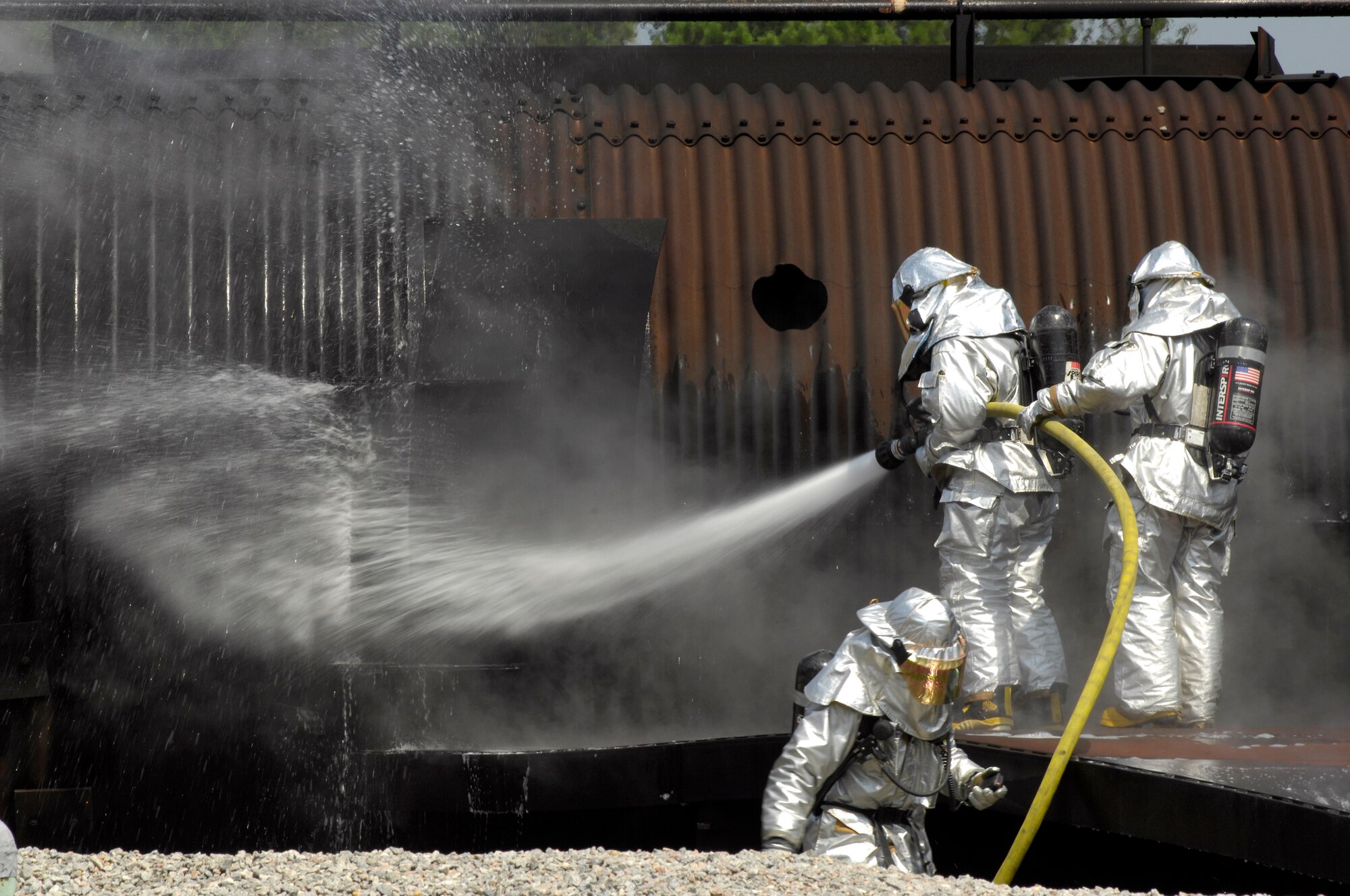 SHAW AIR FORCE BASE, S.C. -- Members of the 20th Civil Engineer Squadron fire protection flight neutralize a live fire during Team Shaw's operational readiness inspection, June 15. The ORI will evaluate Shaw's ability to survive and operate in combat conditions. (U.S. Air Force photo/Senior Airman Kathrine McDowell)