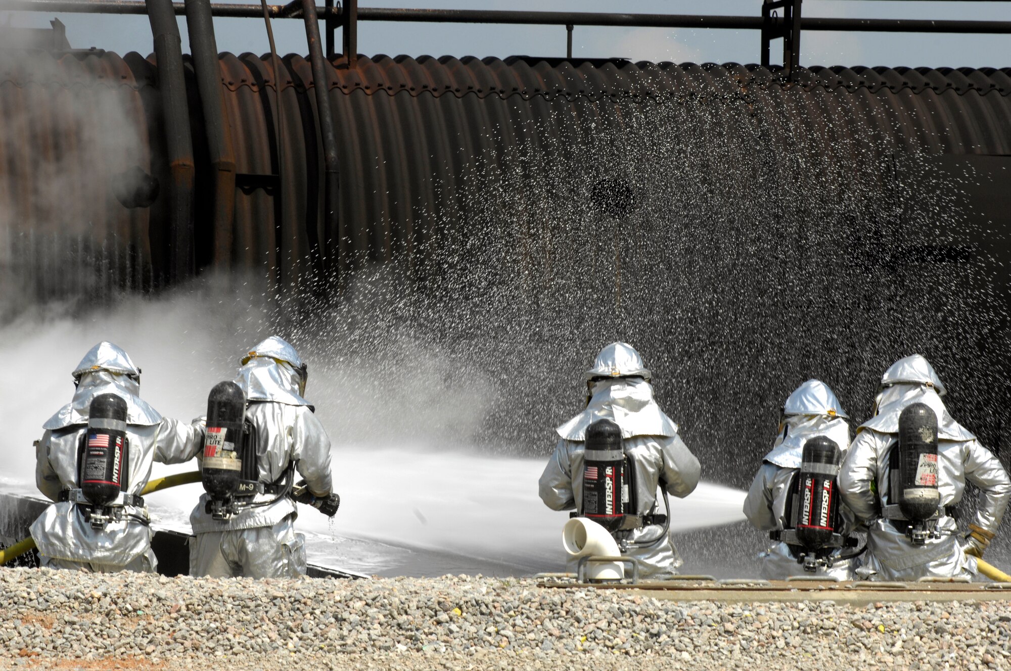 SHAW AIR FORCE BASE, S.C. -- Members of the 20th Civil Engineer Squadron fire protection flight neutralize a live fire during Team Shaw's operational readiness inspection, June 15. The ORI will evaluate Shaw's ability to survive and operate in combat conditions. (U.S. Air Force photo/Senior Airman Kathrine McDowell)