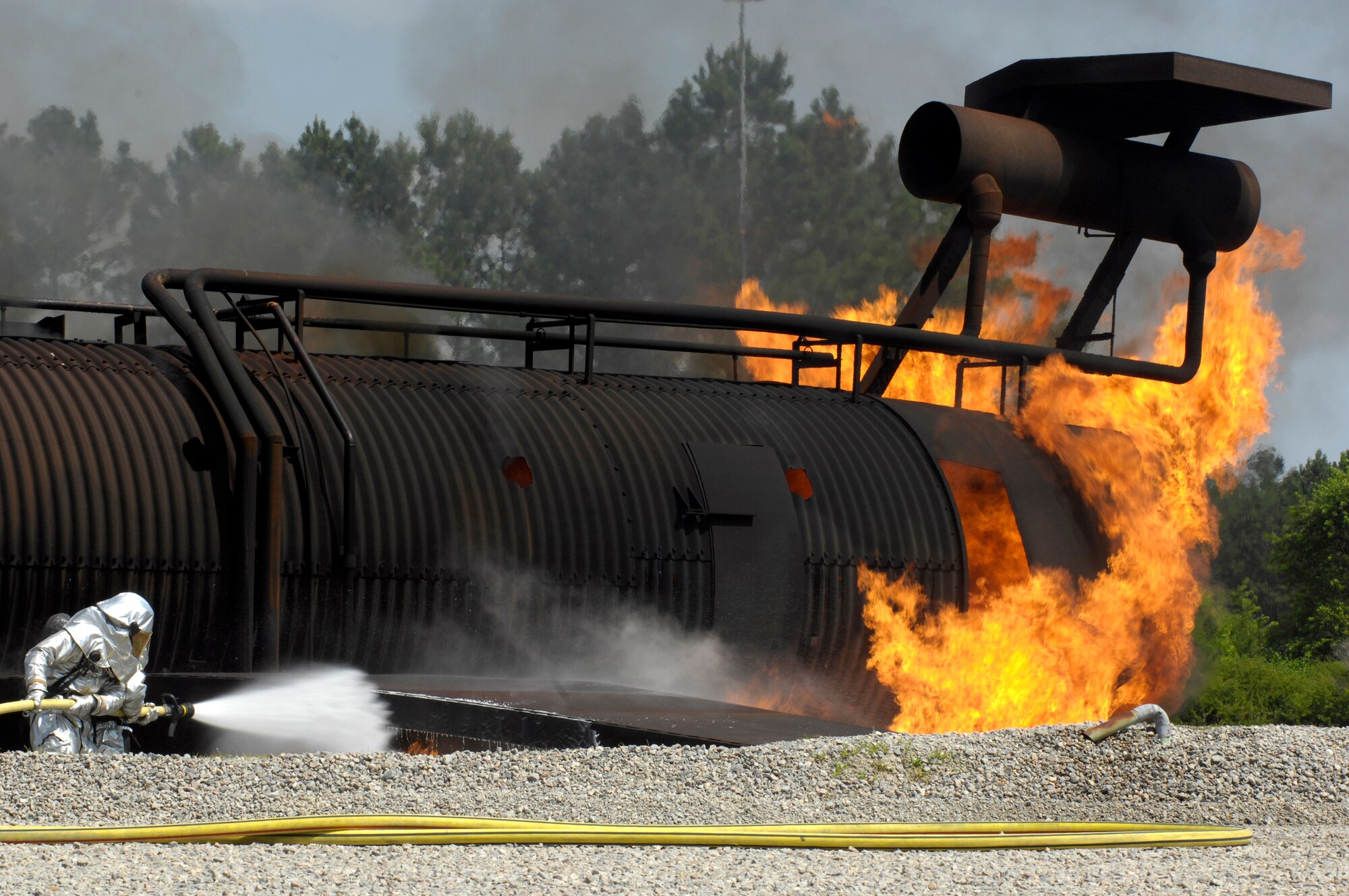 SHAW AIR FORCE BASE, S.C. -- Members of the 20th Civil Engineer Squadron fire protection flight neutralize a live fire during Team Shaw's operational readiness inspection, June 15. The ORI will evaluate Shaw's ability to survive and operate in combat conditions. (U.S. Air Force photo/Senior Airman Kathrine McDowell)