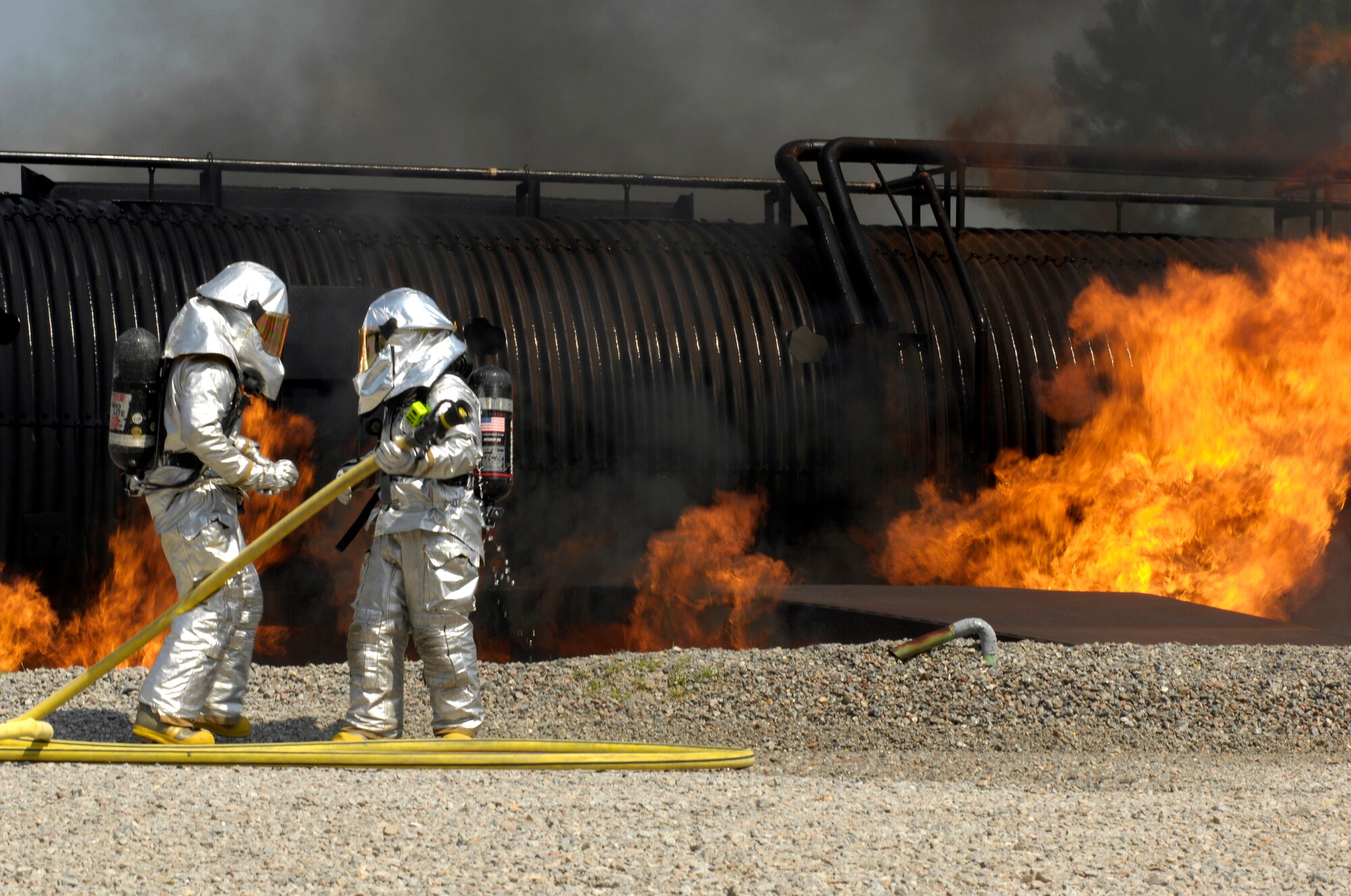 SHAW AIR FORCE BASE, S.C. -- Members of the 20th Civil Engineer Squadron fire protection flight neutralize a live fire during Team Shaw's operational readiness inspection, June 15. The ORI will evaluate Shaw's ability to survive and operate in combat conditions. (U.S. Air Force photo/Senior Airman Kathrine McDowell)