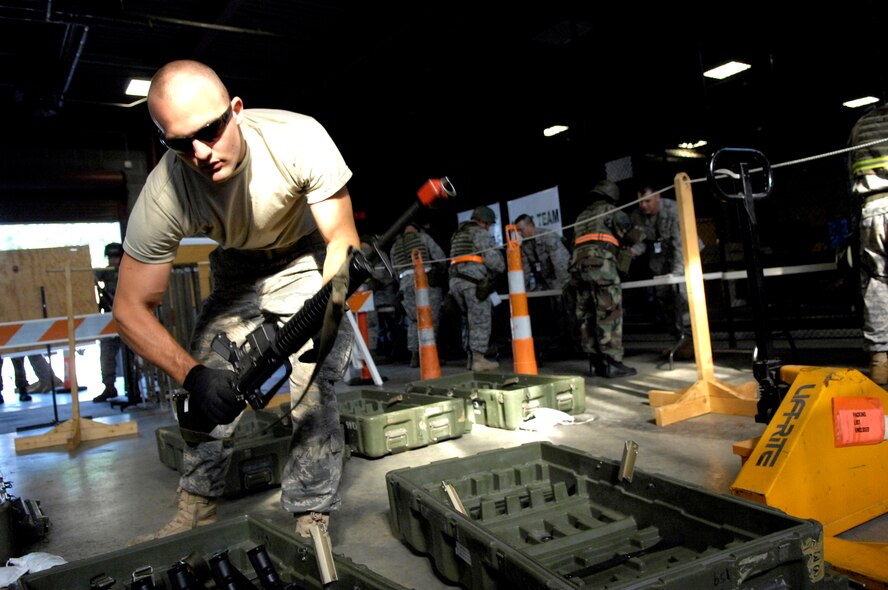 SHAW AIR FORCE BASE, S.C. -- Airman Matthew Martin, 20th Civil Engineer Squadron personnel,  prepares weapons for other members of his squadron for the beginning of Team Shaw's operational readiness inspection, June 15. The ORI will evaluate Shaw's ability to survive and operate in combat conditions. (U.S. Air Force photo/Senior Airman Kathrine McDowell)
