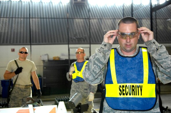 SHAW AIR FORCE BASE, S.C. -- Tech. Sgt. Christopher Watkins, 20th Civil Engineer Squadron utilities systems craftsman, prepares to process other members of his squadron through weapons issue for the start of Team Shaw's operational readiness inspection, June 15. The ORI will evaluate Shaw's ability to survive and operate in combat conditions. (U.S. Air Force photo/Senior Airman Kathrine McDowell) 
