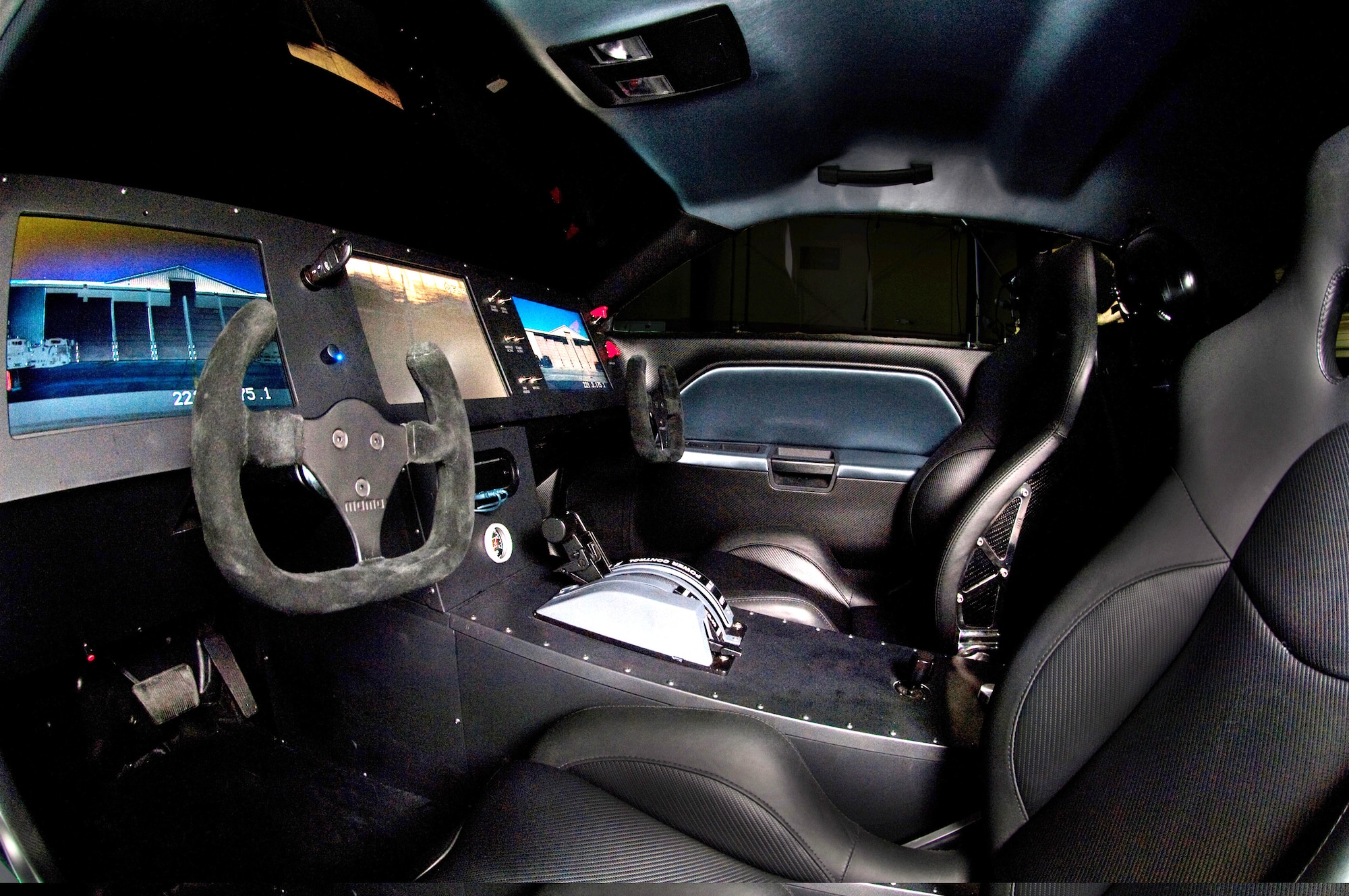 The stealth-black Air Force Challenger 'Vapor' interior features aircraft style controls, a passenger side steering wheel, GPS tracking, night and thermal vision via a film on the front windshield, and the most technologically-advanced computer system with remote control UAV-type access from anywhere in the world utilizing the Internet. The 'Vapor' also comes with two custom flight helmets in line with the Air Force theme of the vehicle. The Vapor is one of the Air Force's newest mobile marketing assets and will be touring high schools and a variety of Air Force sponsored events as part of the 2009 Super Car Tour. (U.S. Air Force photo/Master Sgt. Scott Reed)