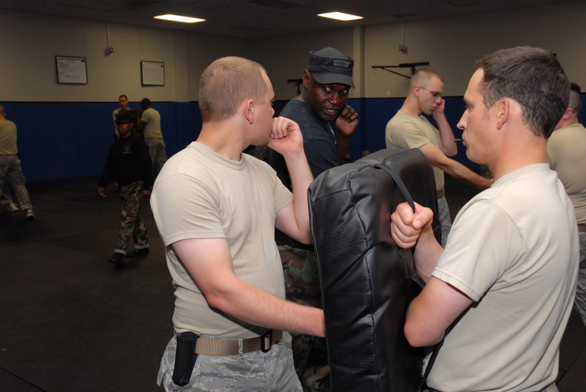 Fly-Away Security Team (FAST) instructor, Tech. Sgt. Jeffrey Cadogan, 421 Combat Training Squadron, instructs a student in the proper strike technique during collapsable baton training at the U.S. Air Force Expeditionary Center, Joint Base McGuire-Dix-Lakehurst, N.J. on June 4, 2009. FAST members provide airfield assessment and aircraft security for Air Force Central Command  transient resources. (U.S. Air Force Photo/Tech. Sgt. Paul R. Evans)