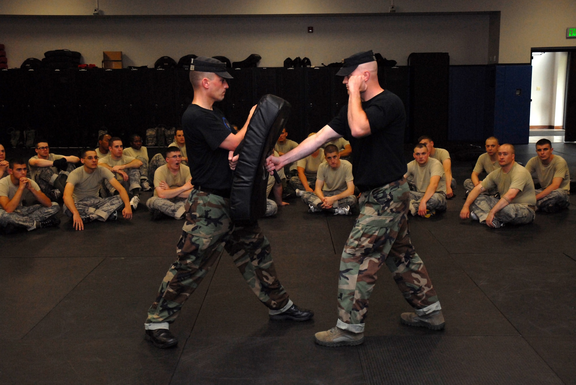 Fly-Away Security Team (FAST) instructors, Technical Sergeants David Balista and George Dollenger, 421 Combat Training Squadron, instructs students in the proper strike technique during collapsable baton training at the U.S. Air Force Expeditionary Center, Joint Base McGuire-Dix-Lakehurst, N.J. on June 4, 2009. FAST members provide airfield assessment and aircraft security for Air Force Central Command  transient resources. (U.S. Air Force Photo/Tech. Sgt. Paul R. Evans)