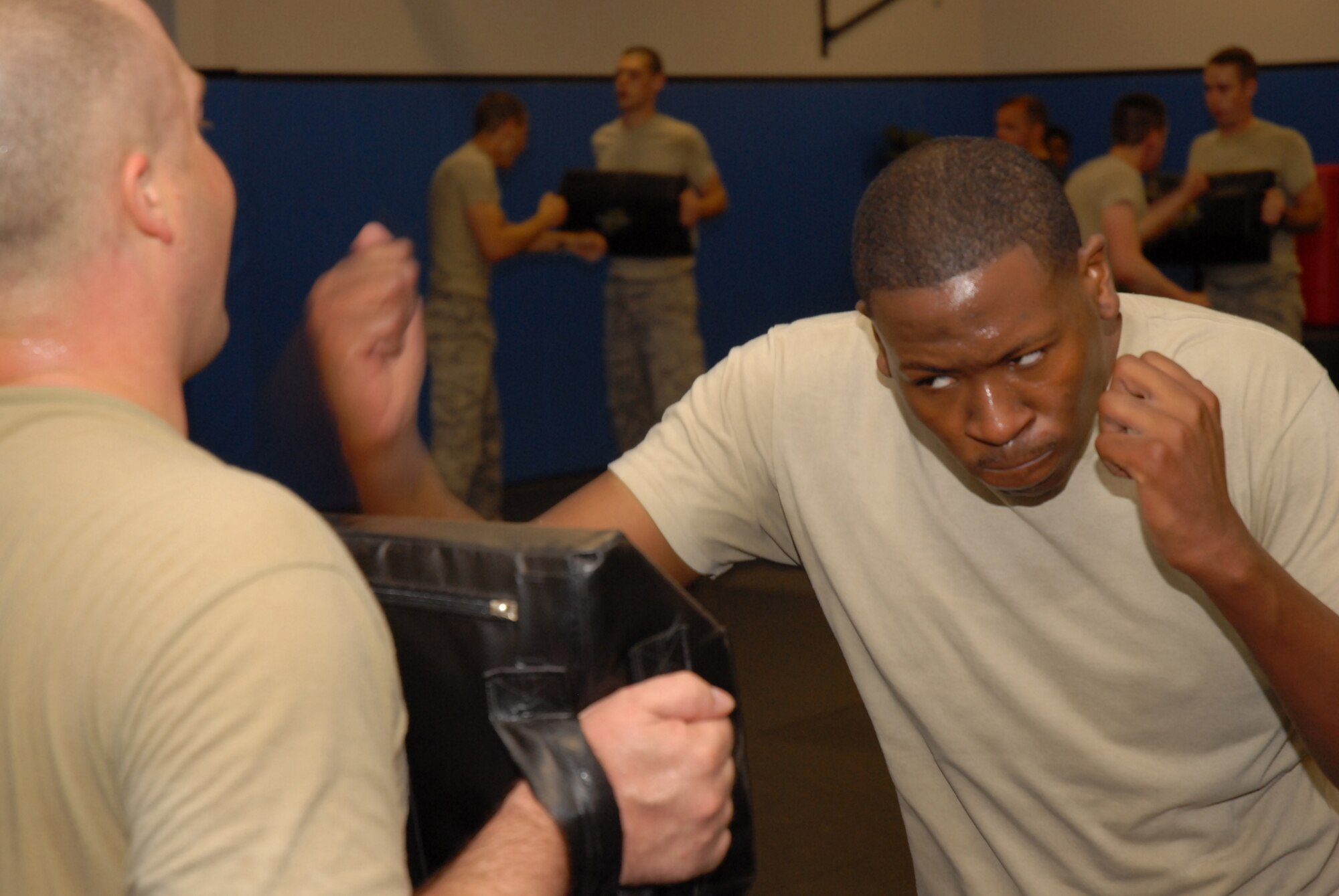 Fly-Away Security Team (FAST) students learn proper strike techniques during ground fighting training at the U.S. Air Force Expeditionary Center, Joint Base McGuire-Dix-Lakehurst, N.J. on June 4, 2009. FAST members provide airfield assessment and aircraft security for Air Force Central Command  transient resources. (U.S. Air Force Photo/Tech. Sgt. Paul R. Evans)