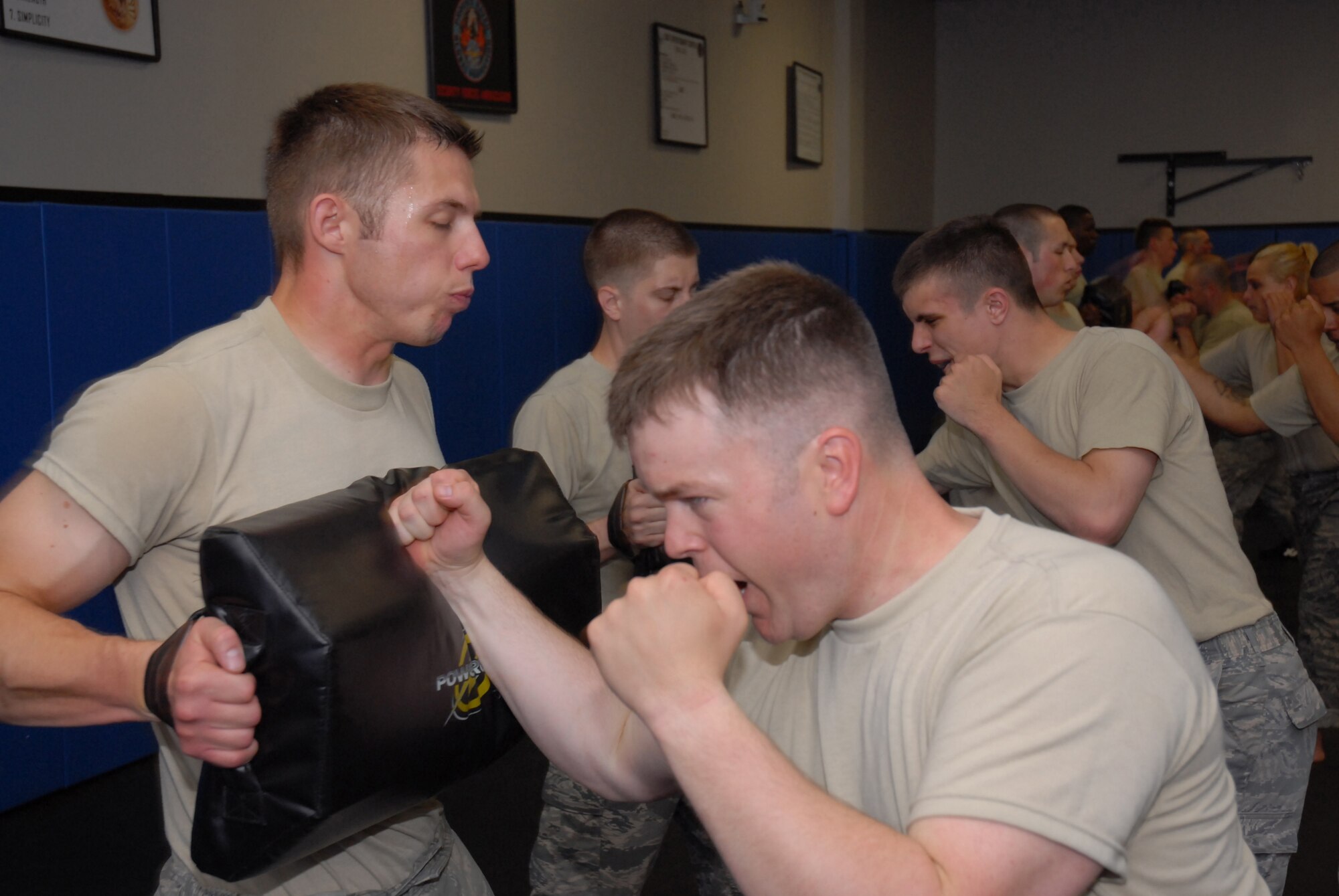 Fly-Away Security Team (FAST) students learn proper strike techniques during ground fighting training at the U.S. Air Force Expeditionary Center, Joint Base McGuire-Dix-Lakehurst, N.J. on June 4, 2009. FAST members provide airfield assessment and aircraft security for Air Force Central Command  transient resources. (U.S. Air Force Photo/Tech. Sgt. Paul R. Evans)