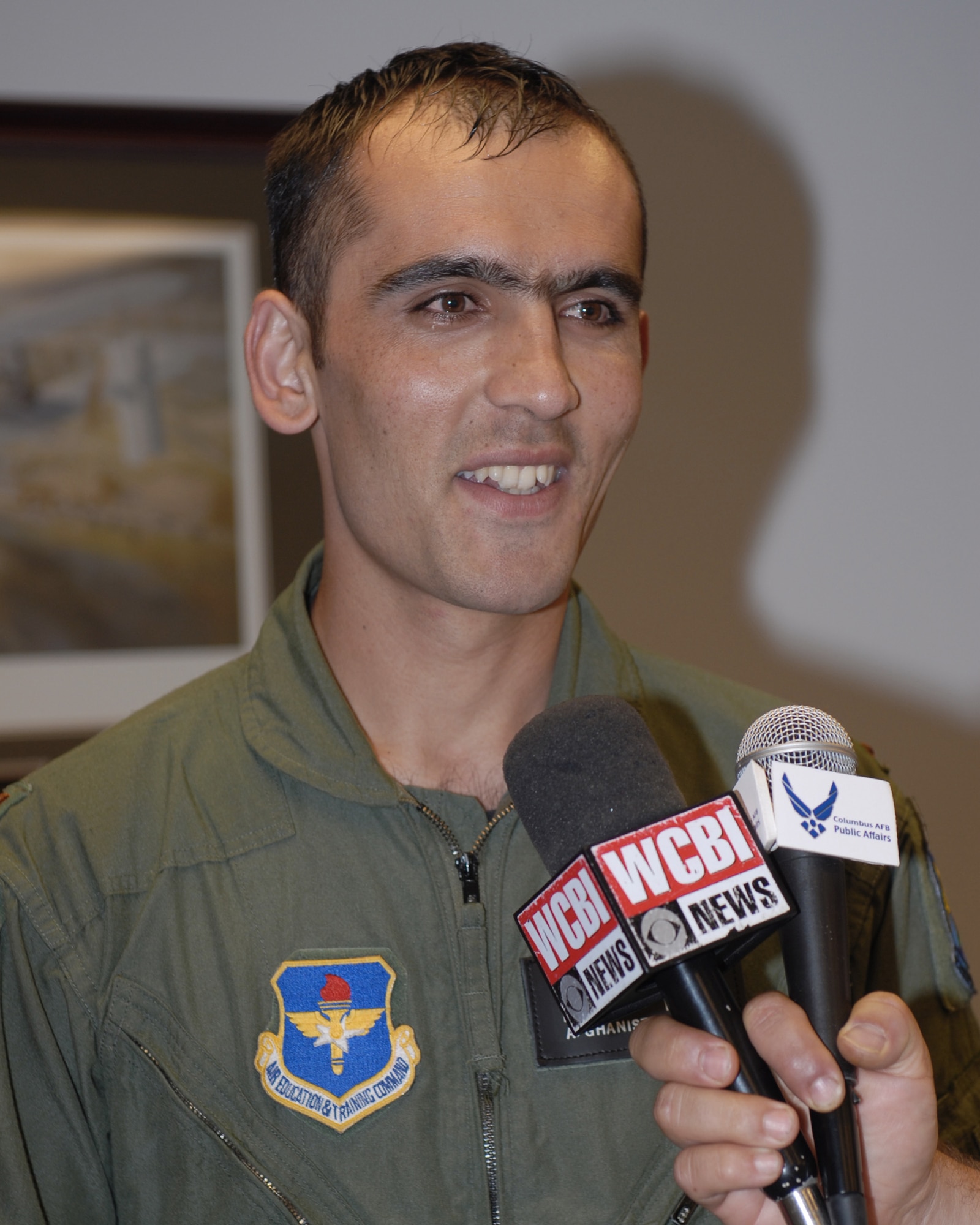Afghan national army air corps Lt. Faiz Ramaki speaks to press following his Aviation Leadership Program graduation ceremony June 12. Lieutenant Ramaki is the first Afghan student to graduate from U.S. pilot training in almost 50 years. Lt. Ramaki will go to fly the C-27A Spartan in the Afghan air corps. (U.S. Air Force Photo/Melissa Duncan
