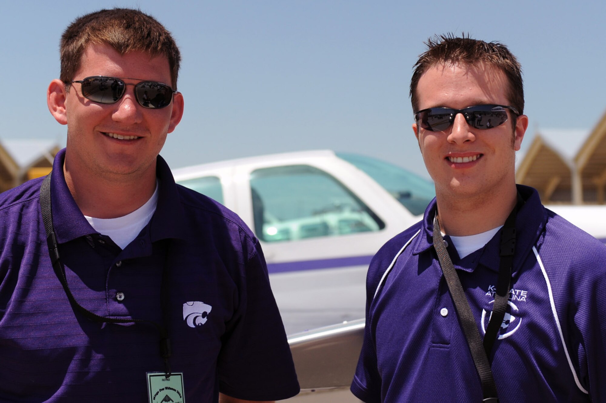 WARRENSBURG, Mo. - Dan Bergman and Danny Sheehy from the Kansas State Aviation program pose in front of their school’s aircraft during the Wings Over Whiteman Air Show and Open House June 6. Another college aviation program at the air show Saturday, the University of Central of Missouri, is based in Warrensburg, Mo. (U.S. Air Force photo/Senior Airman Jason Huddleston)