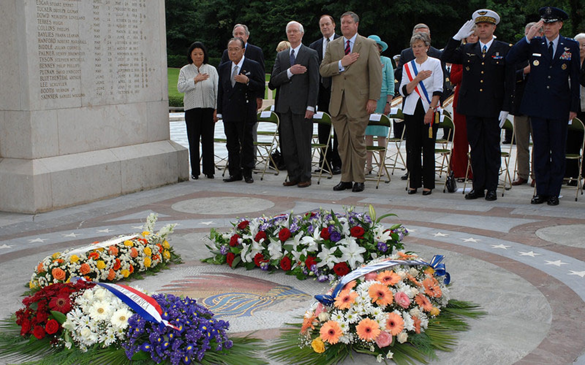 A congressional delegation of six senators, Secretary of the Air Force Michael Donley, French dignitaries and Maj. Gen. William A. Chambers, U.S. Air Forces in Europe vice commander, place their hands over their hearts and salute in tribute during the wreath laying ceremony at the Memorial de l'Escadrille La Fayette just outside of Paris June 13. The wreath ceremony pays honor to the American volunteer combat flying aces known as the "Lafayette Escadrille" who flew under the French flag during World War I. (Department of Defense photo/Master Sgt. Bill Gomez)