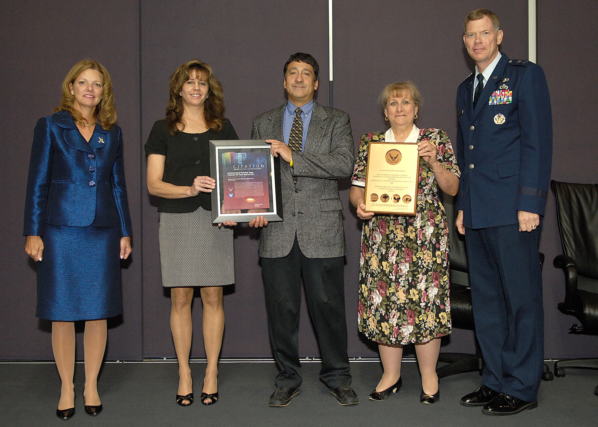 The Peterson Air Force Base Environmental Planning Team was awarded the 2008 National Environmental Policy Act Award June 3 at Andrews Air Force Base, Md. From left to right are: Debra Walker, acting assistant secretary of the Air Force for Installations, Environment and Logistics; Michelle Linn, Air Force Space Command Headquarters, asset management division chief; Dan Rodriguez, 21st Civil Engineer Squadron asset management flight chief; Heidi Mowery, 21st CES NEPA program manager; and Maj. Gen. Del Eulberg, Air Force Civil Engineer. (Air Force photo by Senior Airman Renae Kleckner)