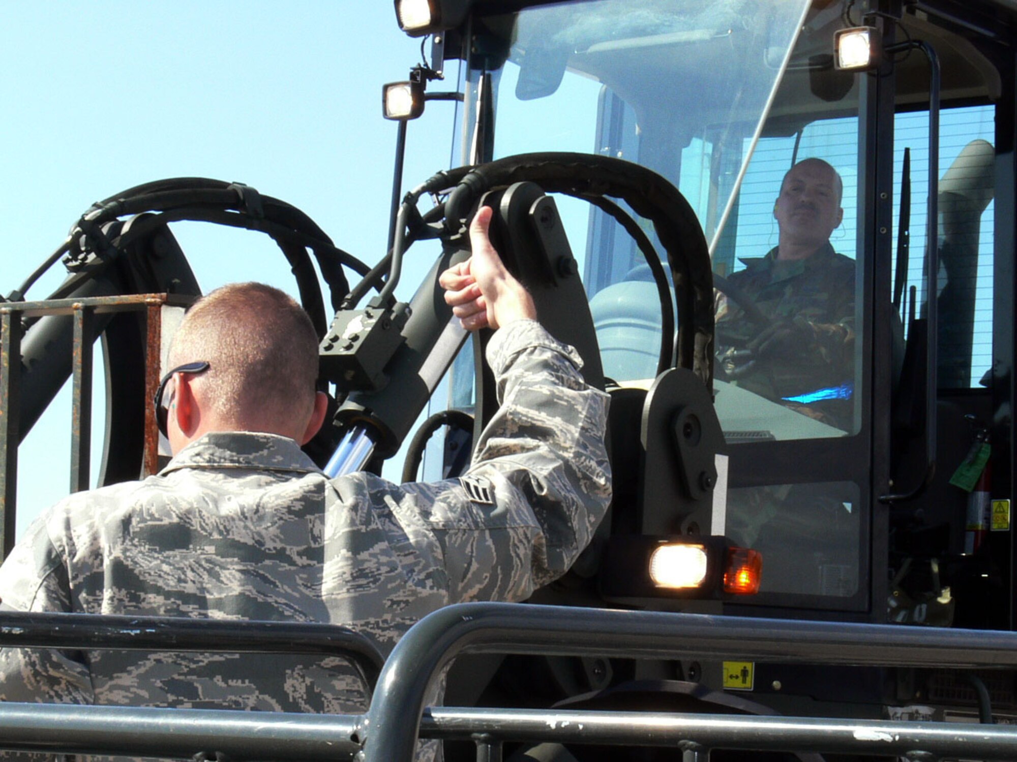 Staff Sgt.Timothy DiSalvo and Senior Airman Johnathan Boyd from the 46th Aerial Port Squadron Dover Air Force Base Del. unload pallets from a KC-10 arriving at Cold Lake Air Base Canada. The 46th APS augmented the 512 ALCF on their deployment to Maple Flag Exercise 42. (U.S. Air Force photo/2nd Lt Joe Simms)