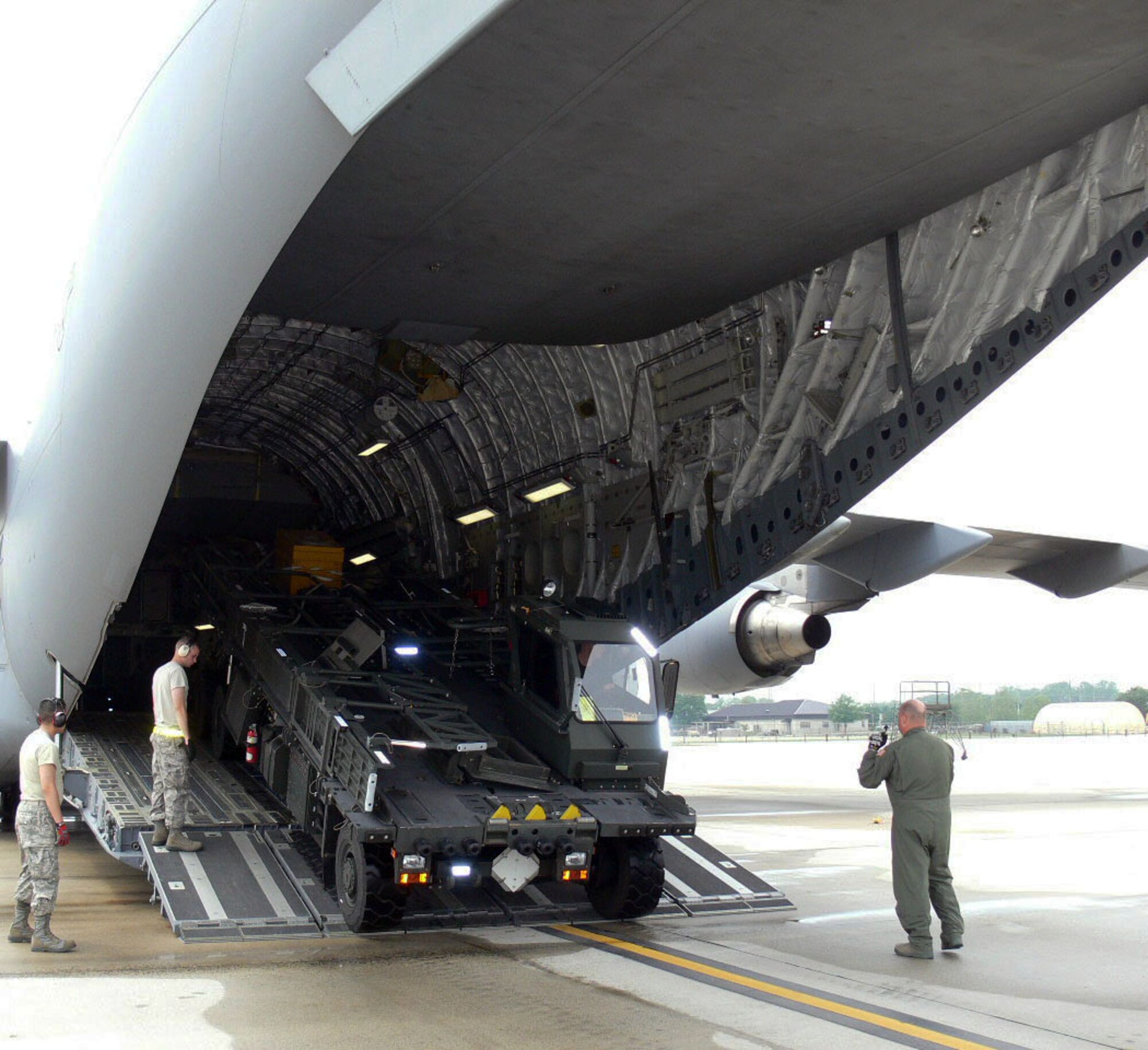 Members from the 512th Airlift Control Flight and 46th Aerial Port Squadron from Dover Air Force Base Del. load a C-17 in preparation for Maple Flag Exercise 42. The ALCF and aerial porters provided air mobility support for the Canadian Air Force during the exercise.  (U.S. Air Force photo/2nd Lt Joe Simms)