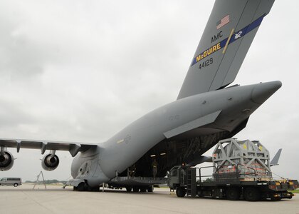 Airmen from Scott Air Force Base, Ill., load an MRI machine onto a C-17 Globemaster III here June 12, 2009. The MRI machine, which was donated by Washington University in Saint Louis, Mo., will be flown to Salta, Argentina, by the U.S. Air Force to aid in their humanitarian mission there. (U.S. Air Force photo/Airman 1st Class Wesley Farnsworth)