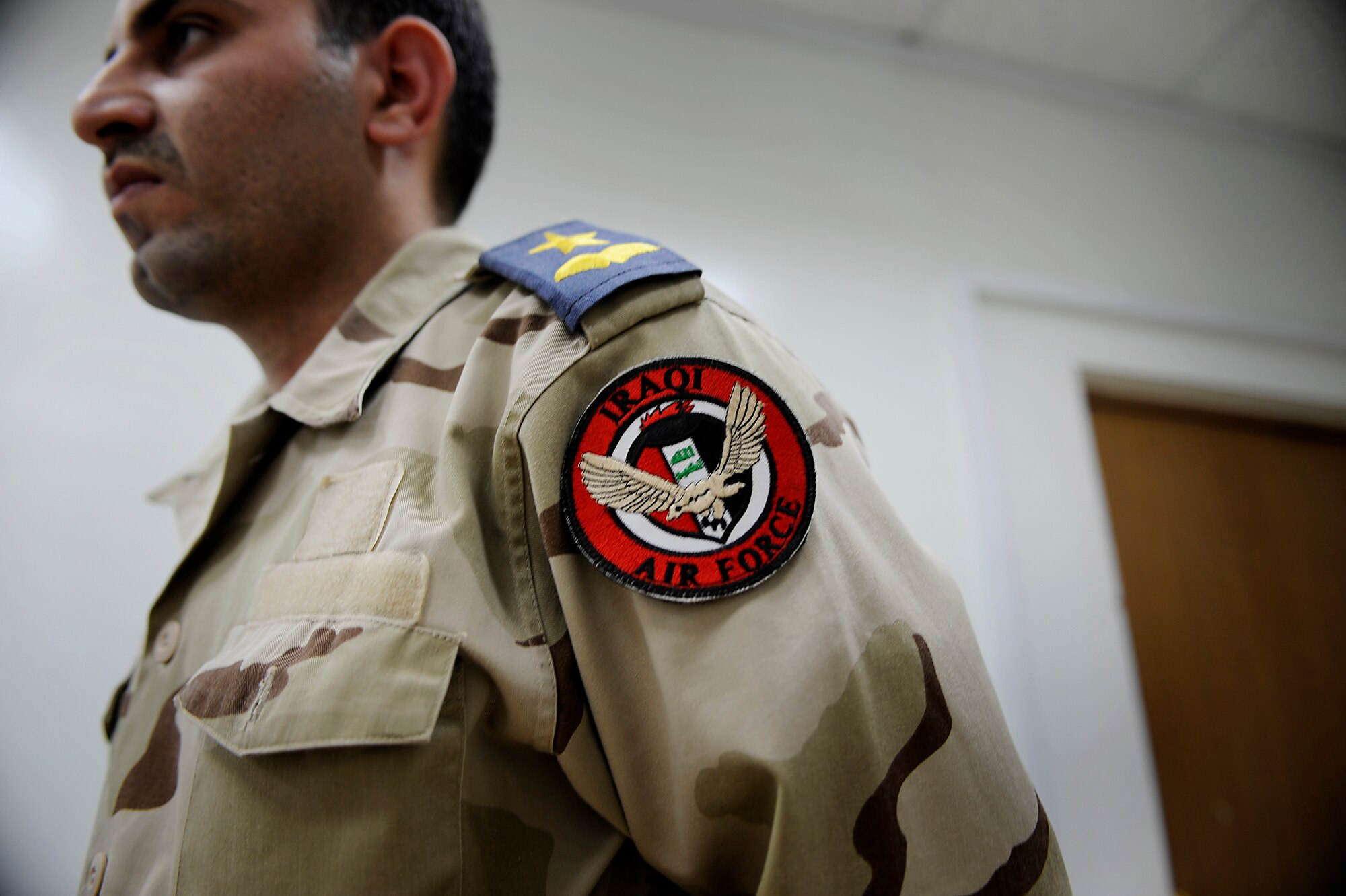 An Iraqi Air Force Airman discusses flight plans prior to departing for a mission to provide air support of combat operations May 8, 2009, at Al Muthana Air Base, Iraq.  (U.S. Air Force Photo by Staff Sgt. Shawn Weismiller)