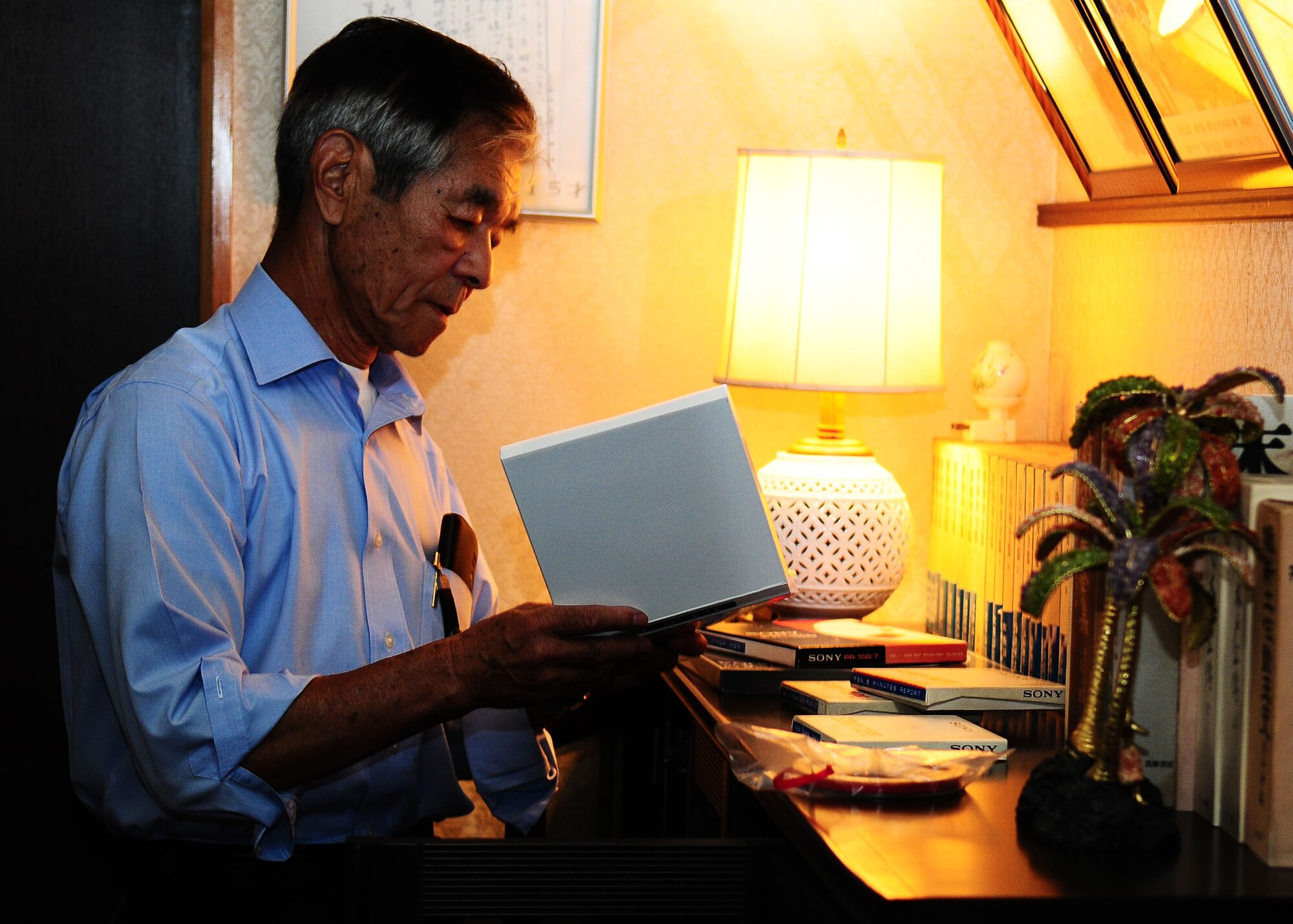 HAMURA, Japan -- Mr. Shoichi Takuchi changes the reel to reel audio recording of the Far East Network in his home in Hamura, Japan June 11. Mr. Takuchi made these recordings when he was a young man to practice his English and to listen to the music. FEN started broadcasting on Sept. 12, 1945 and broadcasted for 52 years until 1997 when the FEN network changed to the American Forces Network we have today.  (U.S. Air Force photo/Airman 1st Class Michael Dillon)