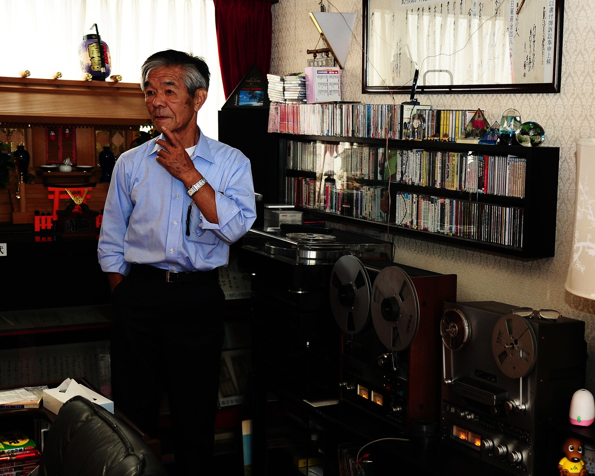 HAMURA, Japan -- Mr. Shoichi Takuchi changes the reel to reel audio recording of the Far East Network in his home in Hamura, Japan June 11. Mr. Takuchi made these recordings when he was a young man to practice his English and to listen to the music. FEN started broadcasting on Sept. 12, 1945 and broadcasted for 52 years until 1997 when the FEN network changed to the American Forces Network we have today.  (U.S. Air Force photo/Airman 1st Class Michael Dillon)