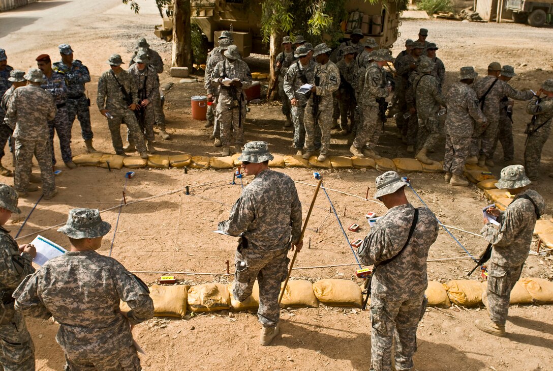 U.S. Army Capt. Matthew Hopper briefs soldiers assigned to the 1st Battalion, 82nd Field Artillery, B Battery June 5, 2009, on the standard operating procedures for the upcoming air assault mission.  The soldiers are coordinating this mission with the Iraqi national police. 