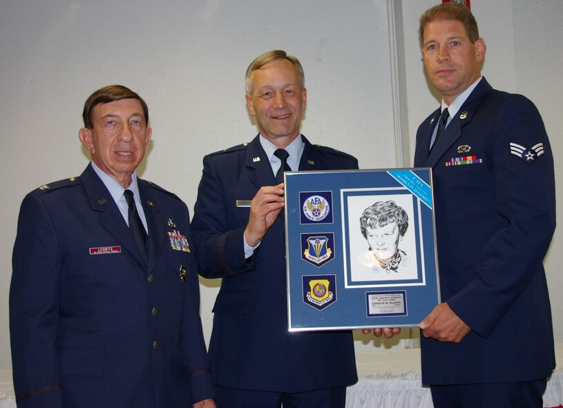 AIRMAN OF THE YEAR: Col. Ledwitz and Brig. Gen. Crabtree present Senior Airman Charles M. Elliott with the USAF Reserve Airman of the Year award. Elliott works in the 452nd Civil Engineering Squadron. (U.S. Air Force photo by George Williams)