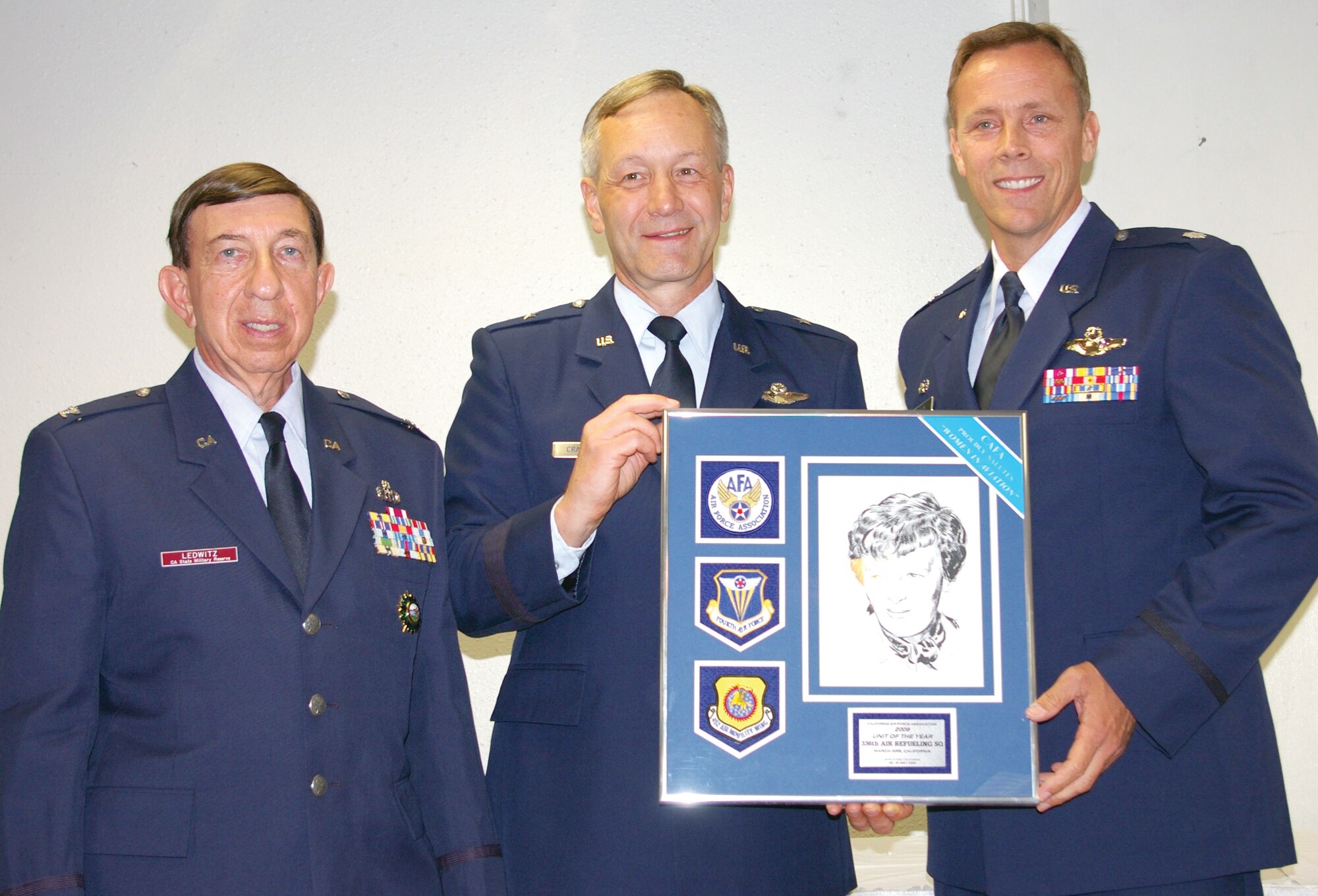 TOP UNIT: Col. Ledwitz (CSMR), left, and Brig. Gen. Crabtree present Lt. Col. James R. Barkley with the award for the CAFA Air Force Unit of the Year. Colonel Barkley is the commander of the winning unit, the 336th Air Refueling Squadron. (U.S. Air Force photo by George Williams)